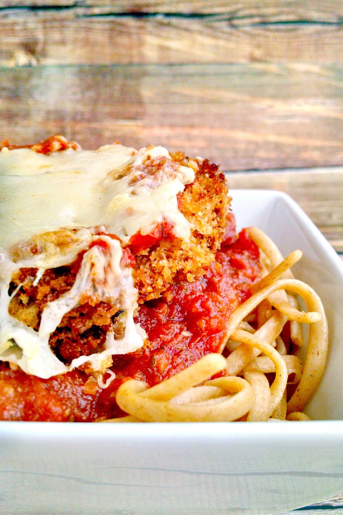 Discover the perfect blend of crispy and cheesy with this mouth-watering Baked Eggplant Parmesan recipe.  It's a great way to sneak in veggies! #eggplant #eggplantParm #Parmrecipe #meatless #meatfree #BakedEggplantParmesan #MeatlessMonday #VegetarianRecipes #HealthyEating #ItalianFoodLove