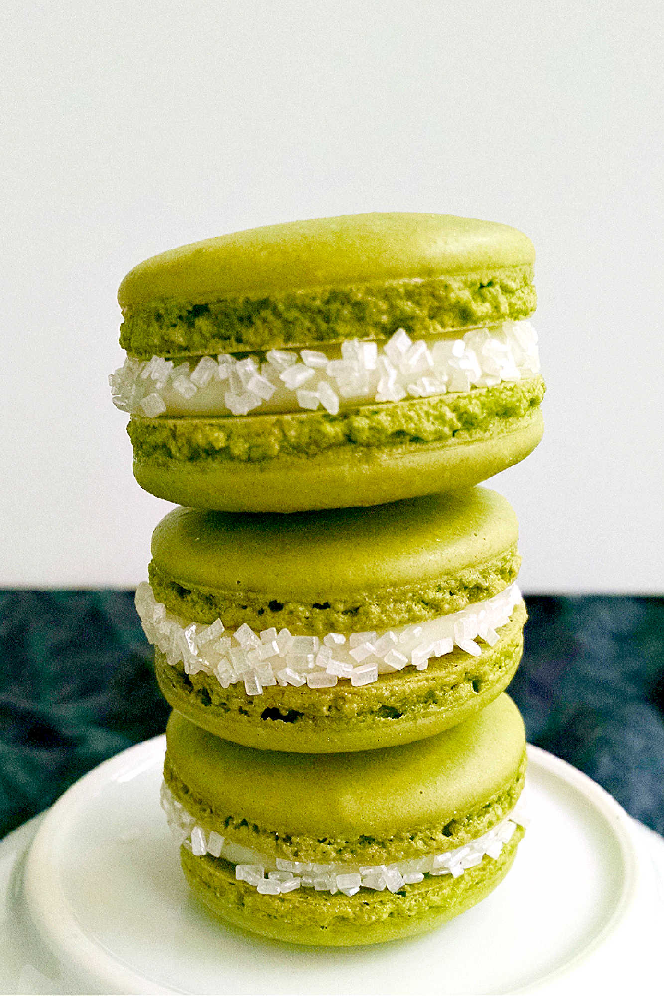Indulge in the sweetness of summer with a Peach Green Tea Macaron. Perfect for tea time or a mid-day treat! #MacaronLoversUnite #FruityFrenchTreats #DelicateDesserts #PeachyPerfection #TeaTimeTreats