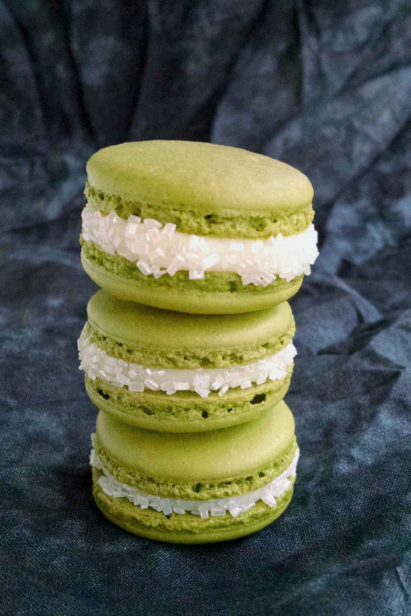 Indulge in the sweetness of summer with a Peach Green Tea Macaron. Perfect for tea time or a mid-day treat! #MacaronLoversUnite #FruityFrenchTreats #DelicateDesserts #PeachyPerfection #TeaTimeTreats