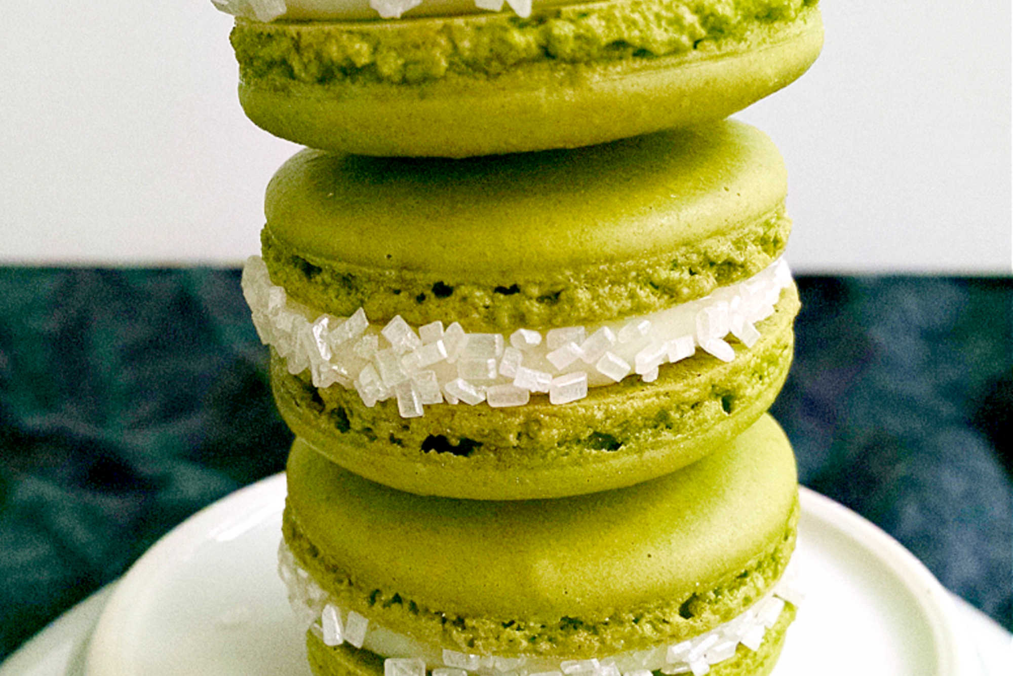 Indulge in the sweetness of summer with a Peach Green Tea Macaron. Perfect for tea time or a mid-day treat! #MacaronLoversUnite #FruityFrenchTreats #DelicateDesserts #PeachyPerfection #TeaTimeTreats