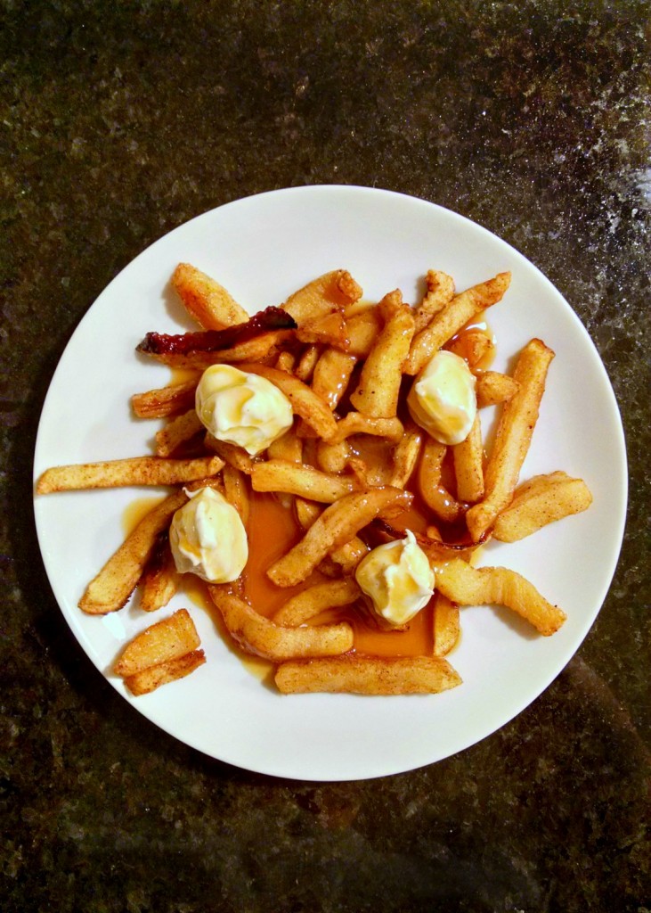 This is not your typical Poutine. This is the Poutine for Dessert variety with apple fries, caramel gravy, and cheesecake curds. Perfect for April Fools Day!