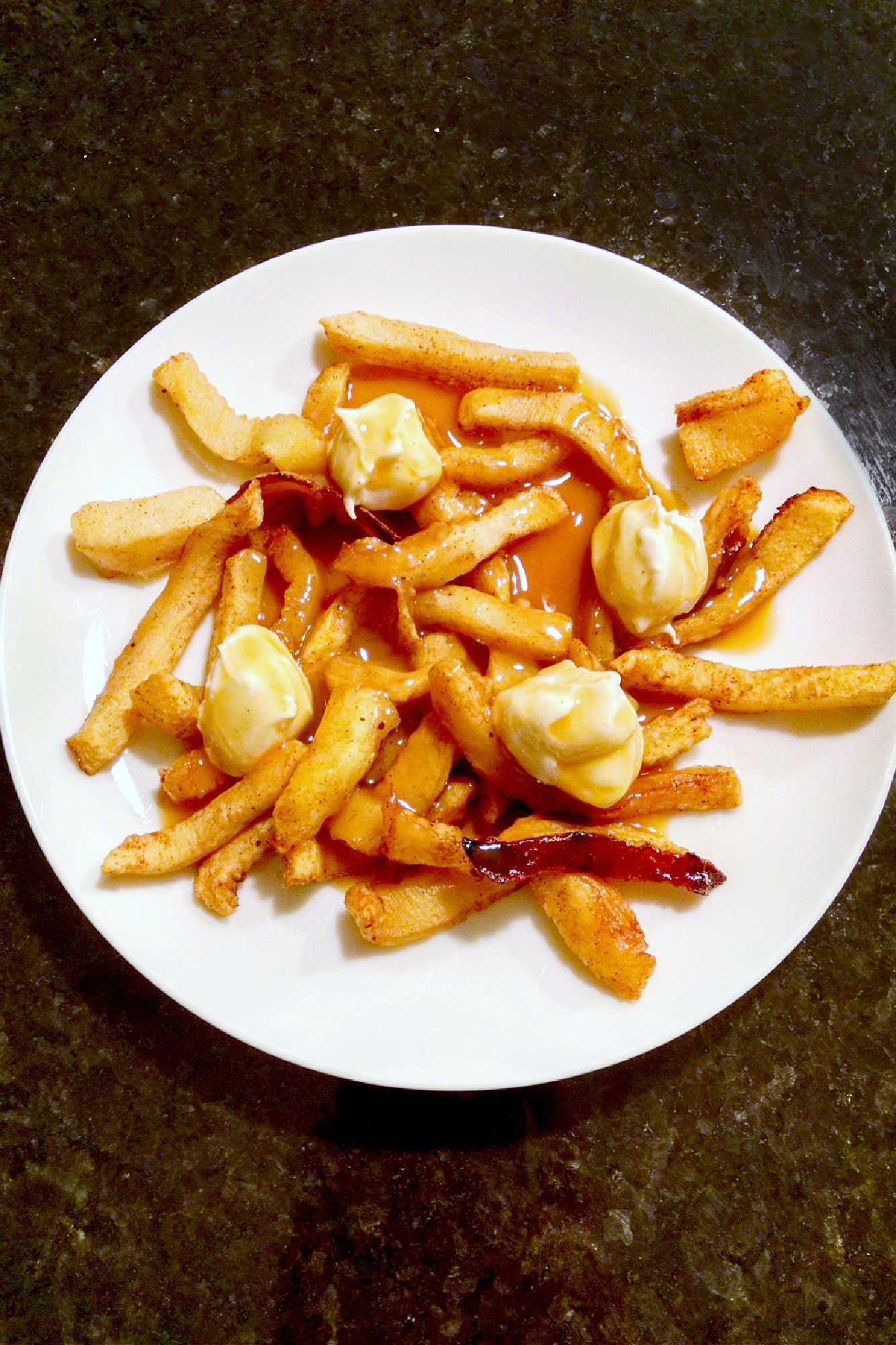 Indulge your sweet tooth with our newest dessert creation: Poutine for Dessert! Apple fries, cream cheese "curds", and a drizzle of caramel sauce for the perfect sweet poutine. Trust us, it's a game changer. #SweetSavoryEats #DessertPoutine #PoutineParadise #UniqueDessert #IndulgentEats
