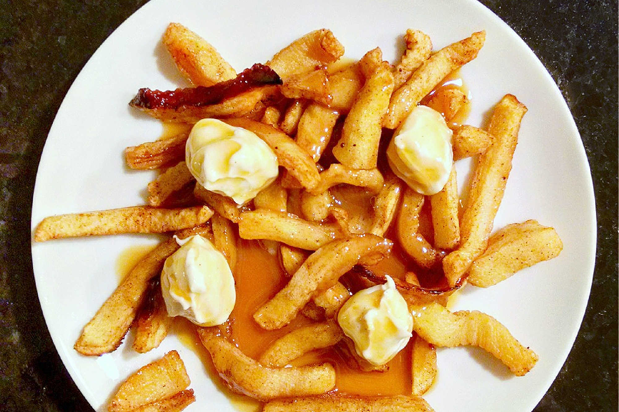 Indulge your sweet tooth with our newest dessert creation: Poutine for Dessert! Apple fries, cream cheese "curds", and a drizzle of caramel sauce for the perfect sweet poutine. Trust us, it's a game changer. #SweetSavoryEats #DessertPoutine #PoutineParadise #UniqueDessert #IndulgentEats
