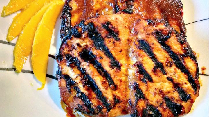 Add a tropical twist to your next BBQ with these mouthwatering Mango Barbecued Pork Chops. Bursting with flavor, they'll be a hit with your family and friends! #MangoBBQPorkChops #TropicalFlavors #GrillMaster #MangoBBQChops #GrillingSeason #PorkChopParadise #TropicalFlavors #FoodieFaves #GrillGoals #FoodieFaves #PorkLoversUnite #SummerEats