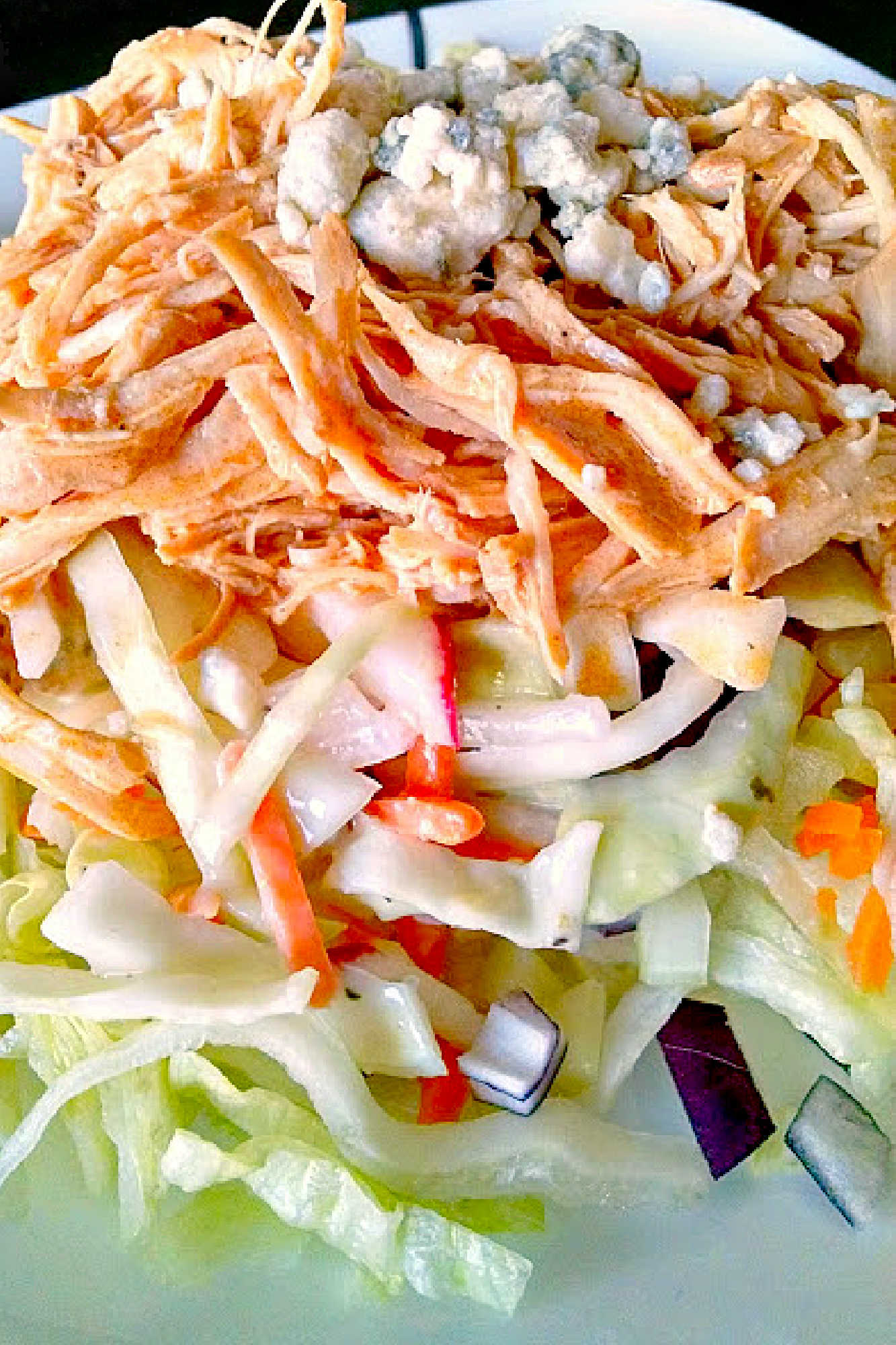 These Buffalo Chicken Tacos with Blue Cheese Radish Slaw will knock your taste buds off! And your family will want these ALL time. Don’t say I didn’t warn you! #OurFamilyTable #BuffaloChicken #chickentacos #bluecheeseslaw #radishslaw #slowcooker #BuffaloChickenTacos #TacoTuesday #GameDay