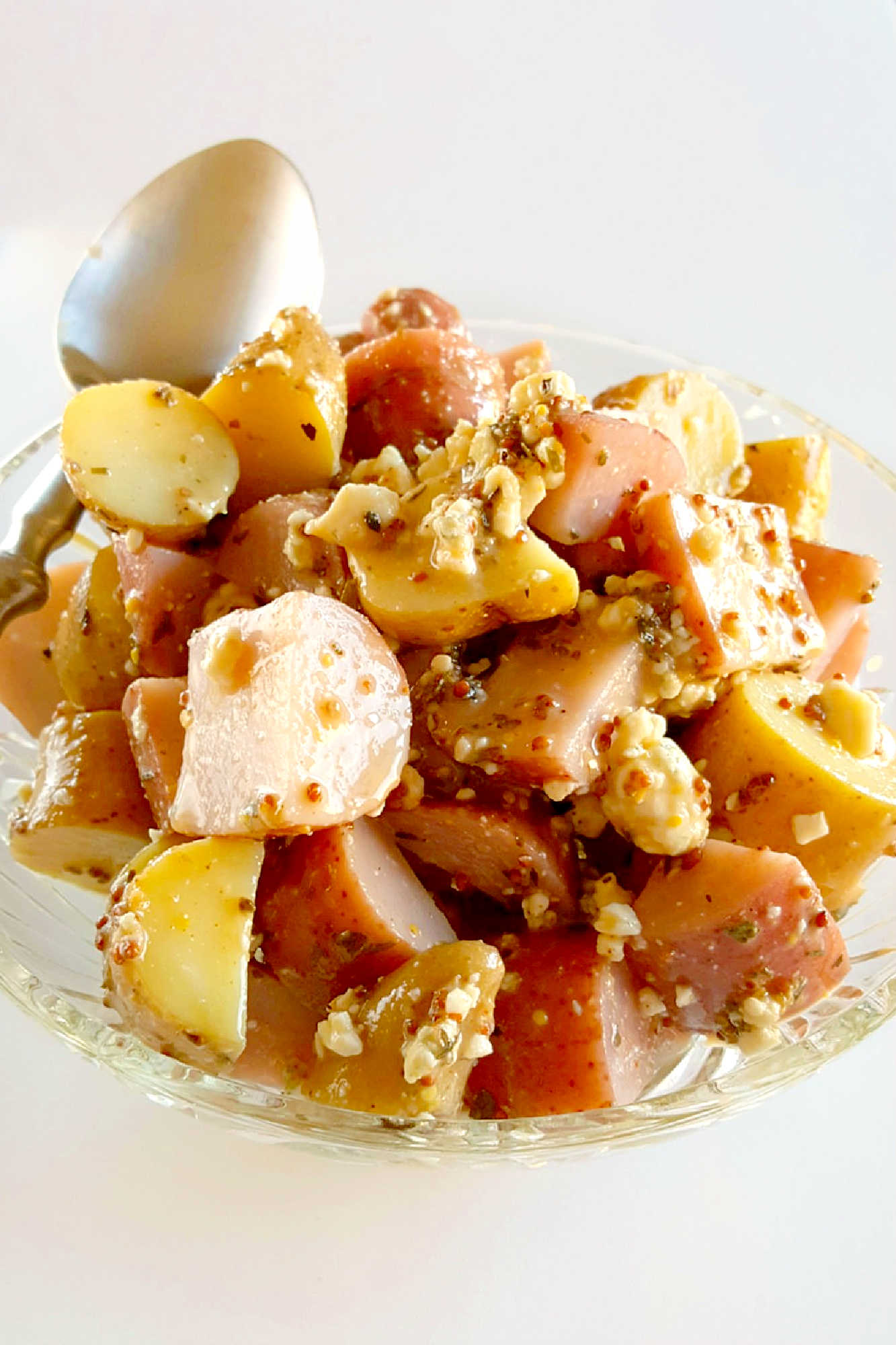 Forget the traditional mayo potato salad and try this irresistible Red White and Blue Cheese Potato Salad!  It will satisfy your #FourthofJuly cravings with creamy potatoes and tangy blue cheese. #potatosalad #bluecheese #vinaigrette #nomayopotatosalad