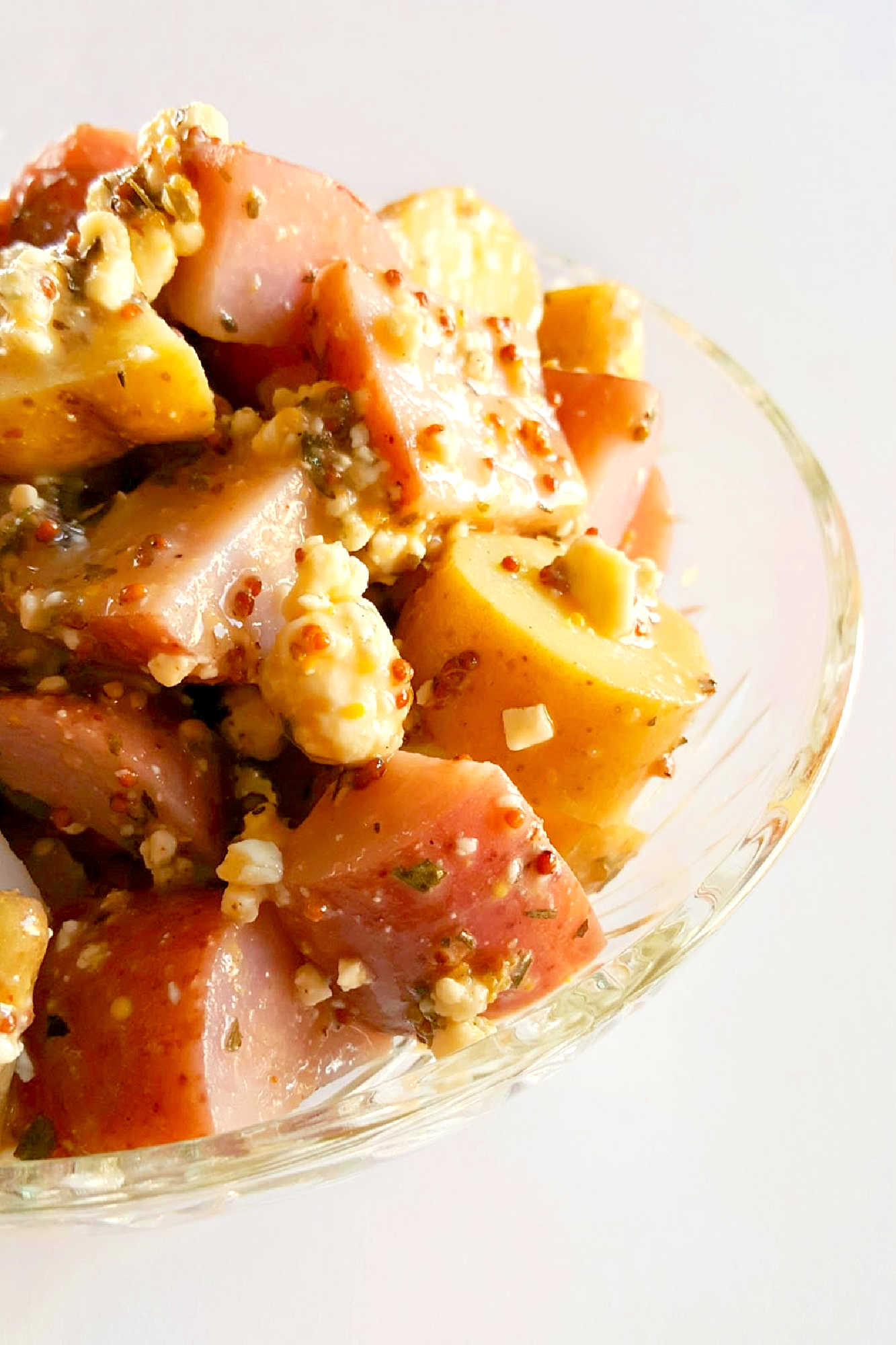 Forget the traditional mayo potato salad and try this irresistible Red White and Blue Cheese Potato Salad!  It will satisfy your #FourthofJuly cravings with creamy potatoes and tangy blue cheese. #potatosalad #bluecheese #vinaigrette #nomayopotatosalad