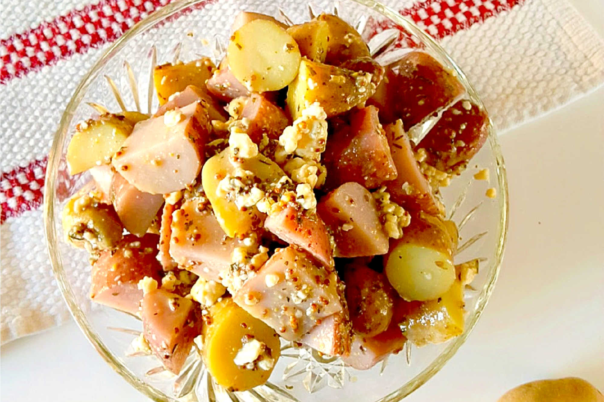 Forget the traditional mayo potato salad and try this irresistible Red White and Blue Cheese Potato Salad! It will satisfy your #FourthofJuly cravings with creamy potatoes and tangy blue cheese. #potatosalad #bluecheese #vinaigrette #nomayopotatosalad