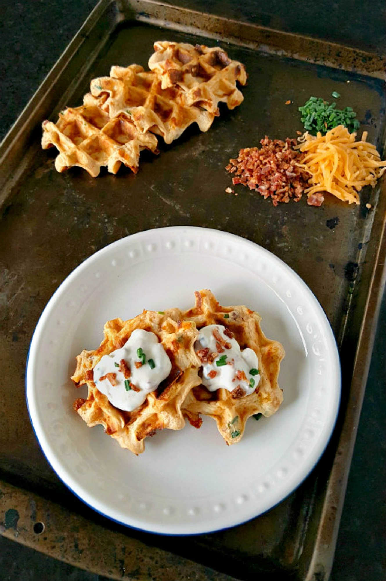 Say goodbye to boring potatoes and hello to these crispy, savory Waffled Twice Baked Potato Pancake Bites. Your taste buds will thank you. #twicebakedpotatopancakes #waffledpotatopancakes #potatopancakebites #brunchideas #savorywaffles
