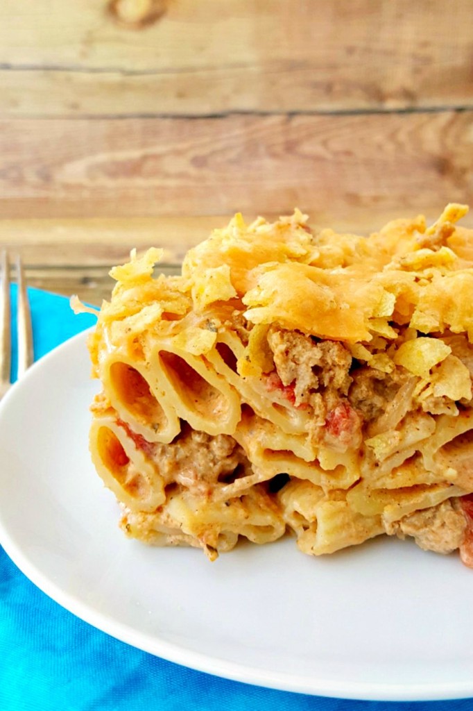 You've found a new family favorite with this Queso con Carne Casserole or Nacho Pasta. It's has delicious cheese, spicy meat, tortilla chips, cheese, and PASTA!
