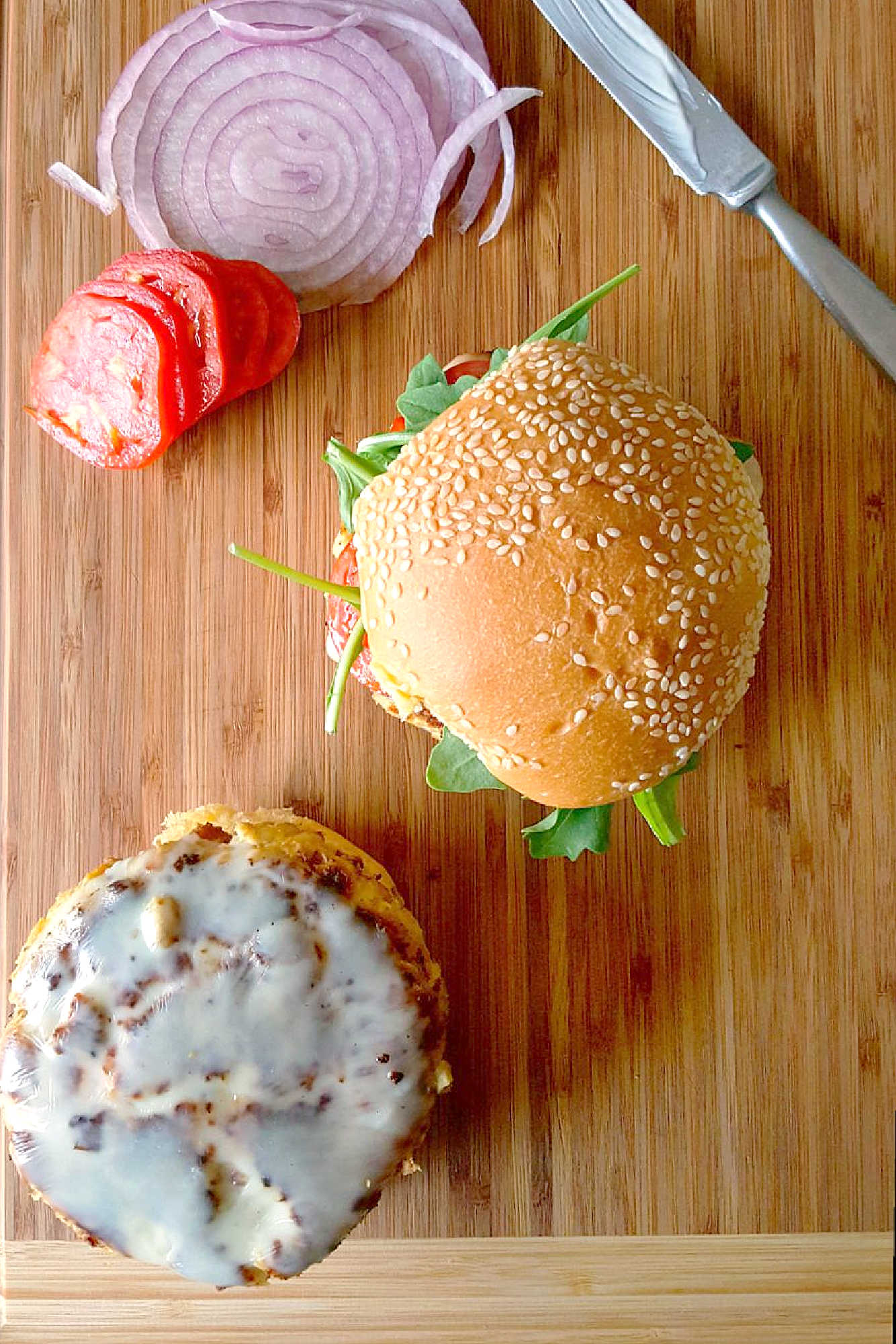 Falafel meets zucchini fritter in this recipe mash up. Courgette and Ricotta Falafel Burgers are healthy, delicious, and perfect for a meatfree meal! #FalafelBurgers #VegetarianEats #HealthyBurgerOptions #MeatlessMonday #CourgetteRicottaCombo
