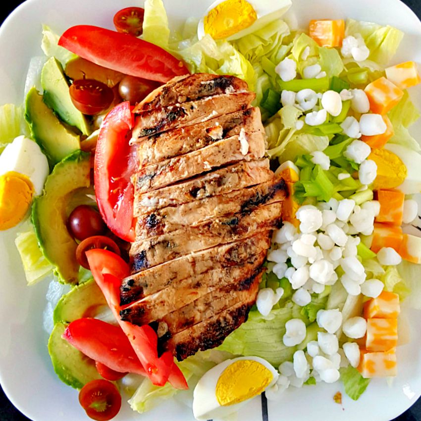 Upgrade your lunch game with the Alabama Cobb Salad. Packed with cool greens and grilled chicken with Alabama white sauce, it's the perfect choice for a summer dinner. #SaladGoals #HealthyEats #SouthernSaladSensation #DeliciousAndNutritious #CobbCravings