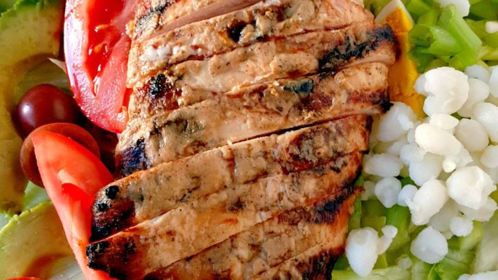 I basted chicken breasts in white barbecue sauce and grilled before slicing and topping this Alabama Cobb Salad. Don't let this white barbecue sauce fool you! It's got a kick!