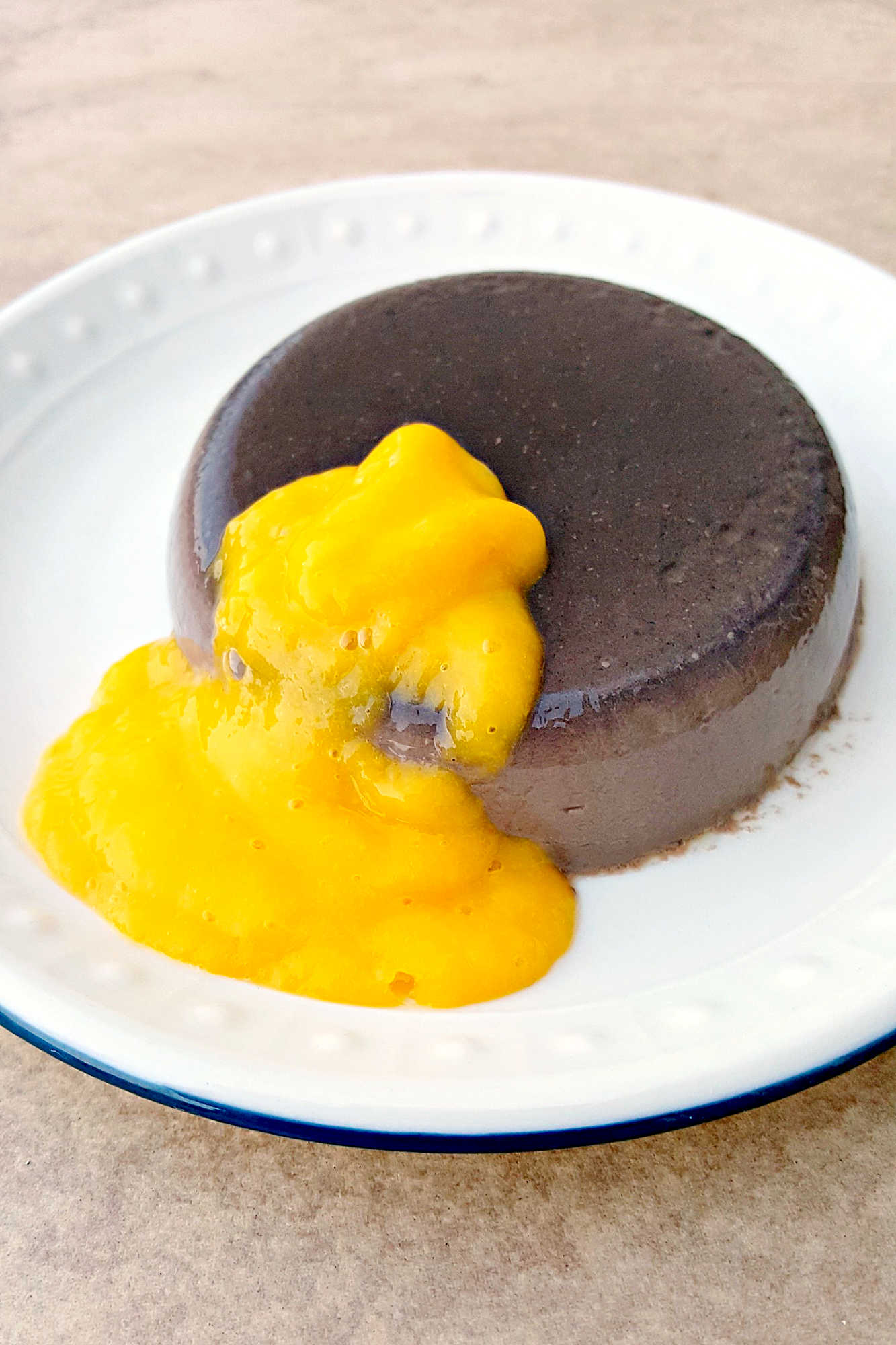 🍫 Dark Chocolate Panna Cotta + 🥭 Mango Coulis = Heaven! #DarkChocolatePannacotta #MangoCoulisDelight #DessertGoals #ChocoholicIndulgence #FoodieFridays #chocolateloversunite #dessertgram #pannacottaperfection #mangomadness #chocolateloverdelight