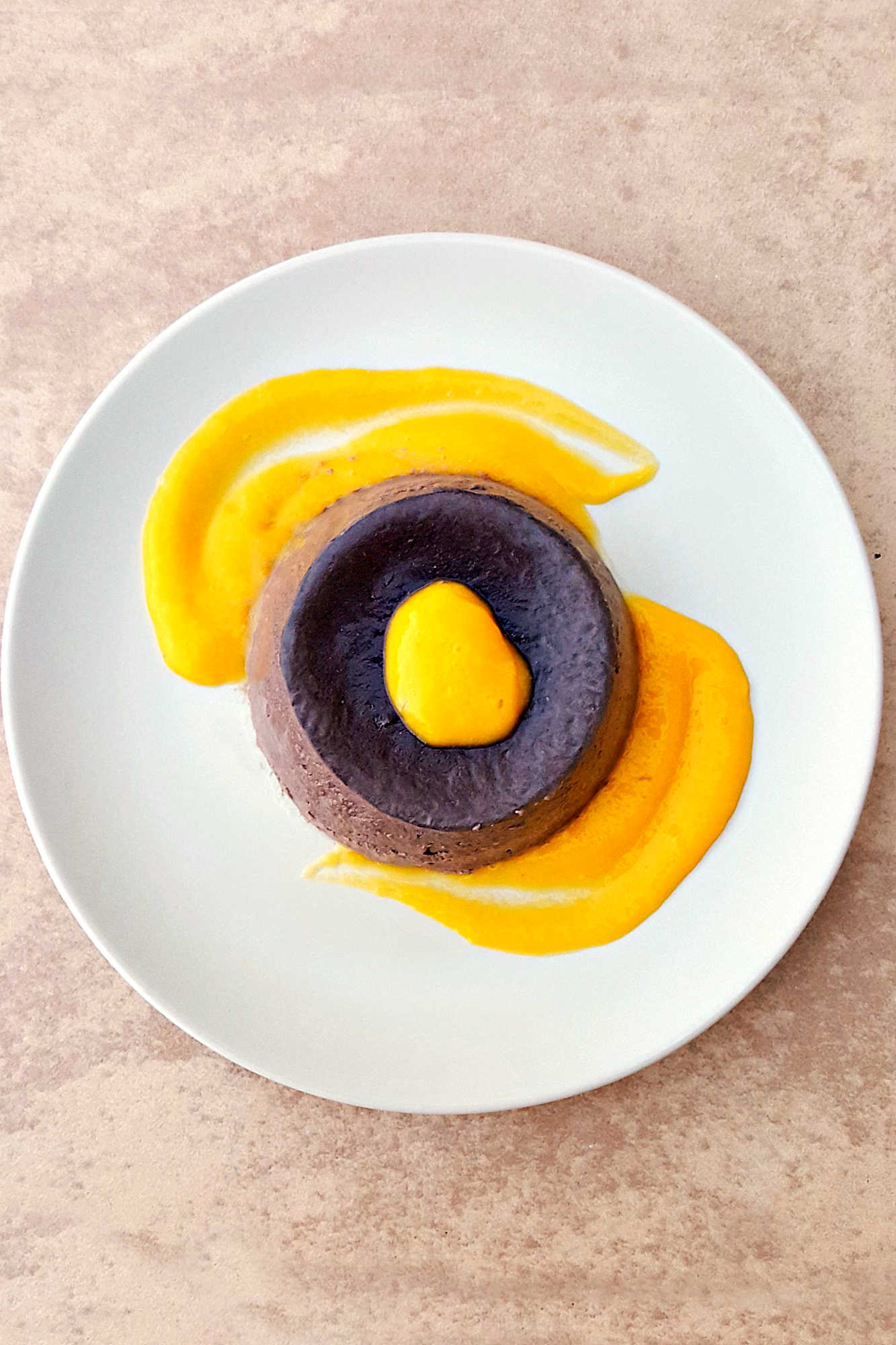🍫 Dark Chocolate Panna Cotta + 🥭 Mango Coulis = Heaven! #DarkChocolatePannacotta #MangoCoulisDelight #DessertGoals #ChocoholicIndulgence #FoodieFridays #chocolateloversunite #dessertgram #pannacottaperfection #mangomadness #chocolateloverdelight