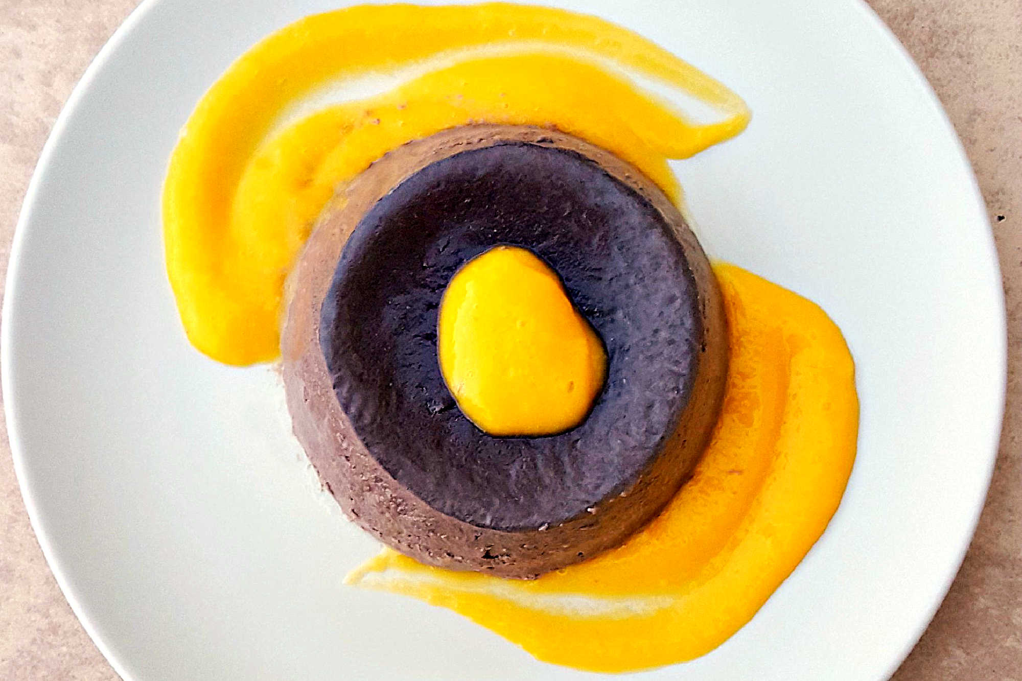 🍫 Dark Chocolate Panna Cotta + 🥭 Mango Coulis = Heaven! #DarkChocolatePannacotta #MangoCoulisDelight #DessertGoals #ChocoholicIndulgence #FoodieFridays #chocolateloversunite #dessertgram #pannacottaperfection #mangomadness #chocolateloverdelight