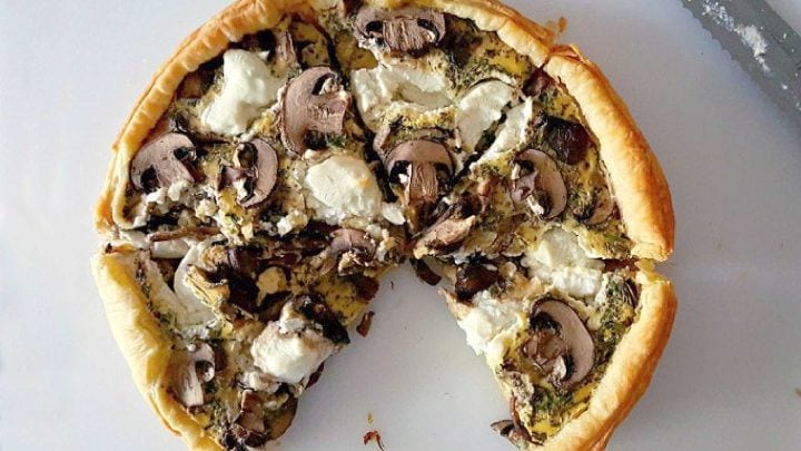 Searching for a flavorful centerpiece? These layers of flaky pastry, earthy mushrooms, and creamy goat cheese come together for a savory tart that's perfect for brunch or a light lunch. Save this recipe for your next meal inspiration. #MushroomCheeseTart #SavoryTart #GoatCheeseObsessed #MushroomLover #FarmToFork #mushroomtart #goatcheeselove #savorytreats #vegetariantart #gourmetfoodie