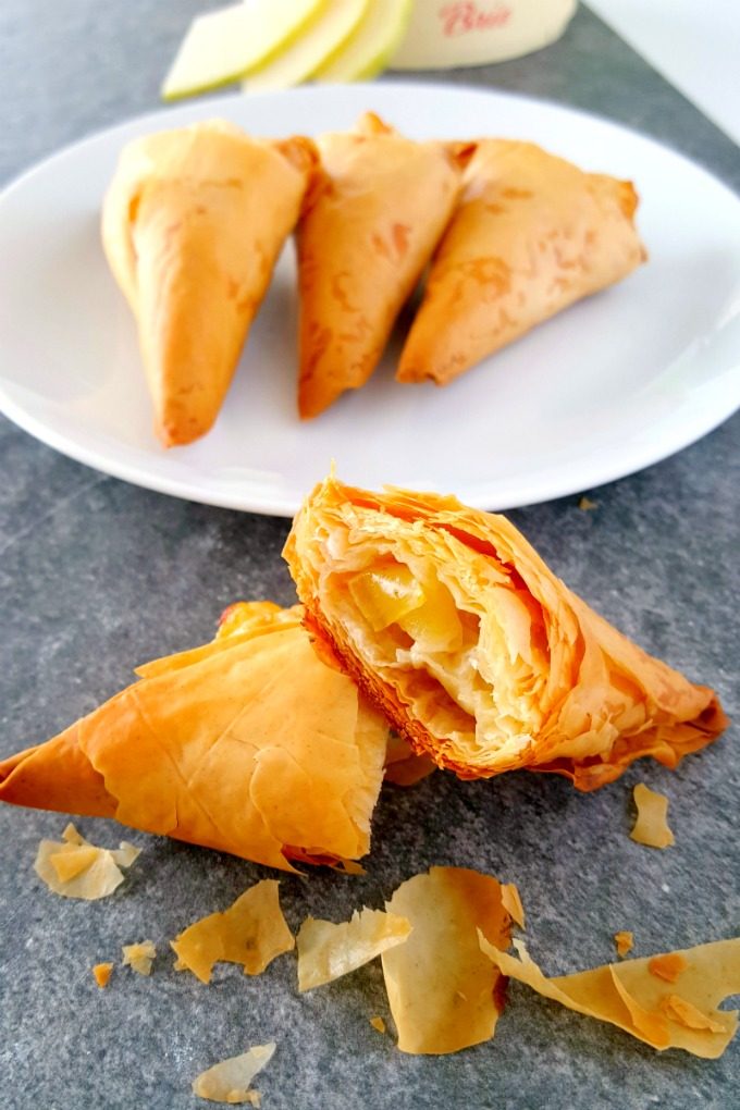 Sweet apples, salty brie, and crispy phyllo dough make the perfect little nibble for you and your sweetheart. Envy Apple Brie Triangles are simple yet perfectly elegant.