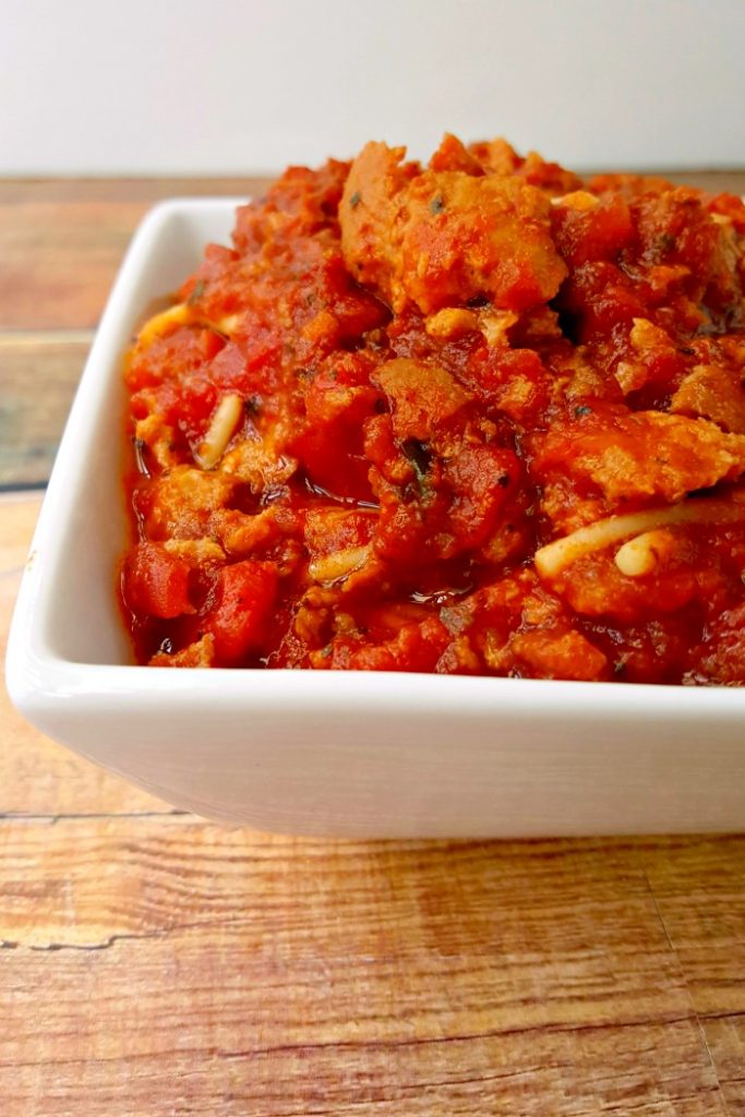 Marked down Italian sausage, 56 ounces of crushed tomatoes, and some herbs and spices make an amazing and simple bolognese style sauce. You will want to make this Slow Cooker Italian Sausage Bolognese repeatedly.