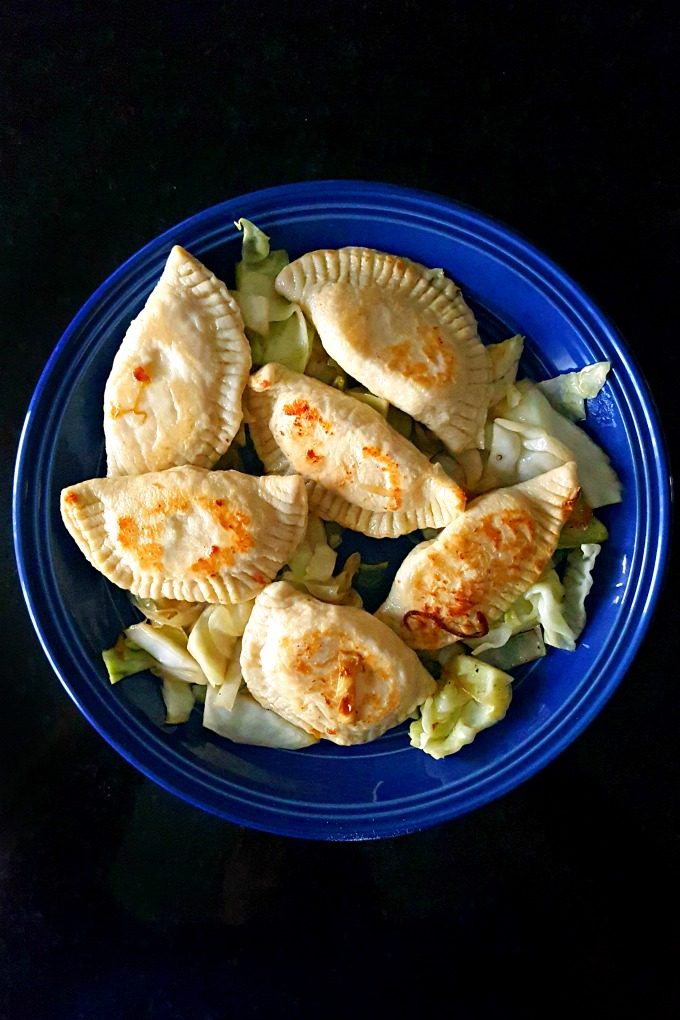 I'm making Mom's Homemade Perogies. It's a family recipe that is tender, tasty, tangy, and delicious! I've filled them with potatoes and extra sharp cheddar cheese.