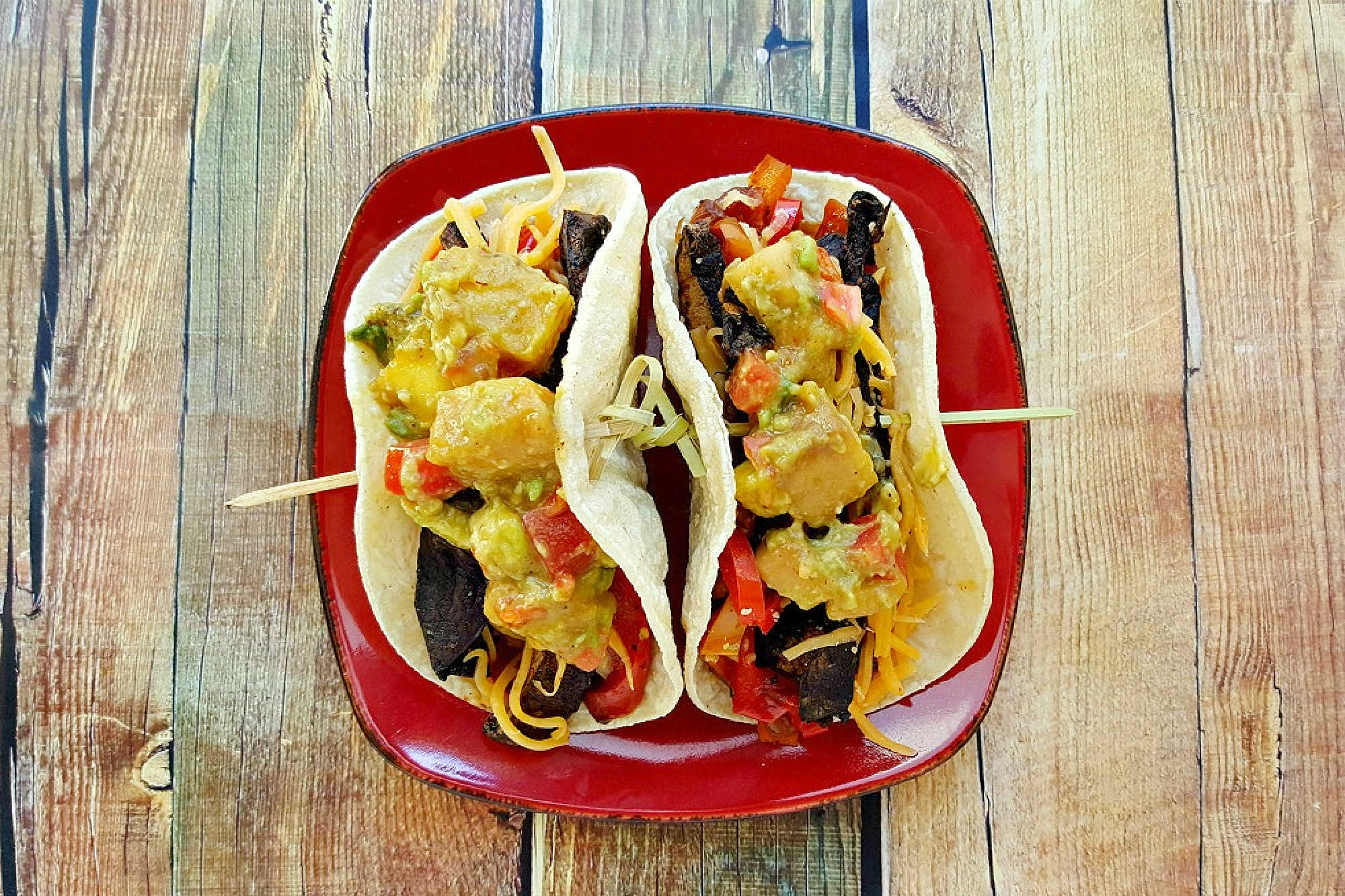 Sheet pan portobello fajitas bring bold flavors and easy clean-up to your table. Enjoy a savory mix of roasted veggies and mushrooms ready in one simple step.  #sheetpanfajitas #portobellos #plantbasedeats #easydinnerideas #weeknightmeals