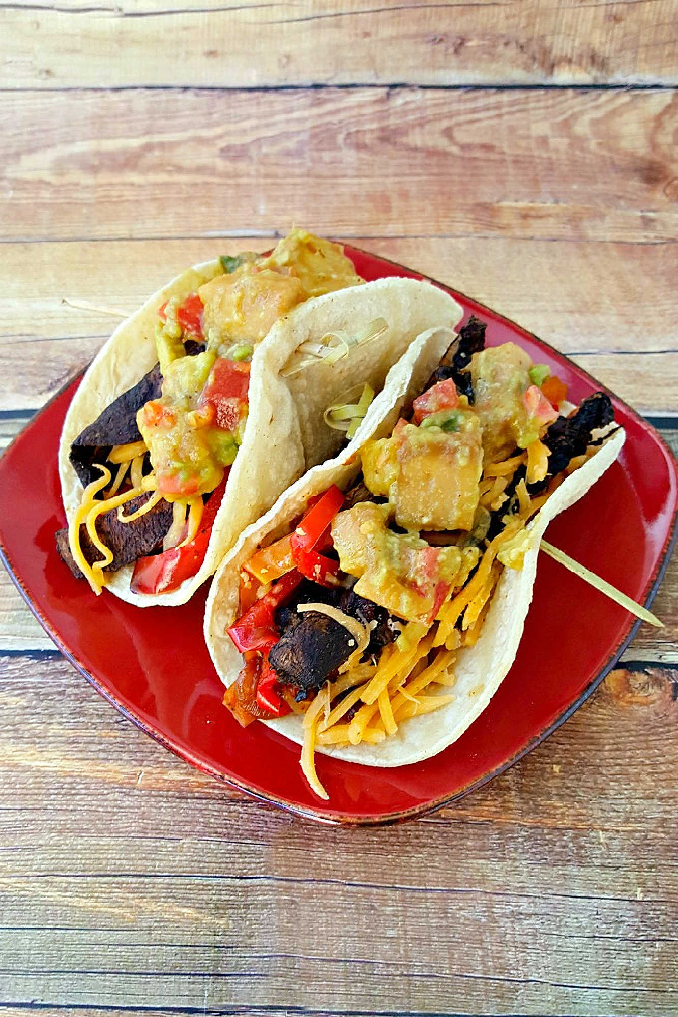 Sheet pan portobello fajitas bring bold flavors and easy clean-up to your table. Enjoy a savory mix of roasted veggies and mushrooms ready in one simple step.  #sheetpanfajitas #portobellos #plantbasedeats #easydinnerideas #weeknightmeals