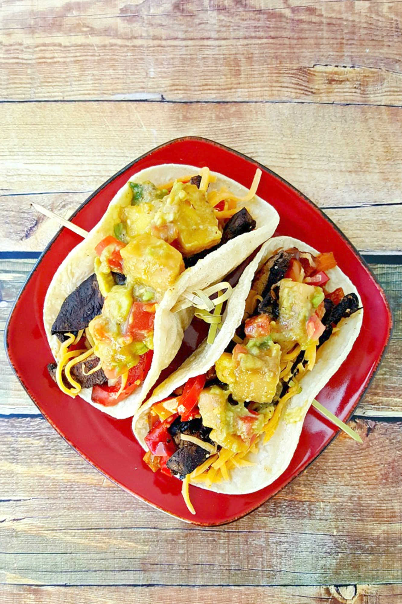 Sheet pan portobello fajitas bring bold flavors and easy clean-up to your table. Enjoy a savory mix of roasted veggies and mushrooms ready in one simple step.  #sheetpanfajitas #portobellos #plantbasedeats #easydinnerideas #weeknightmeals