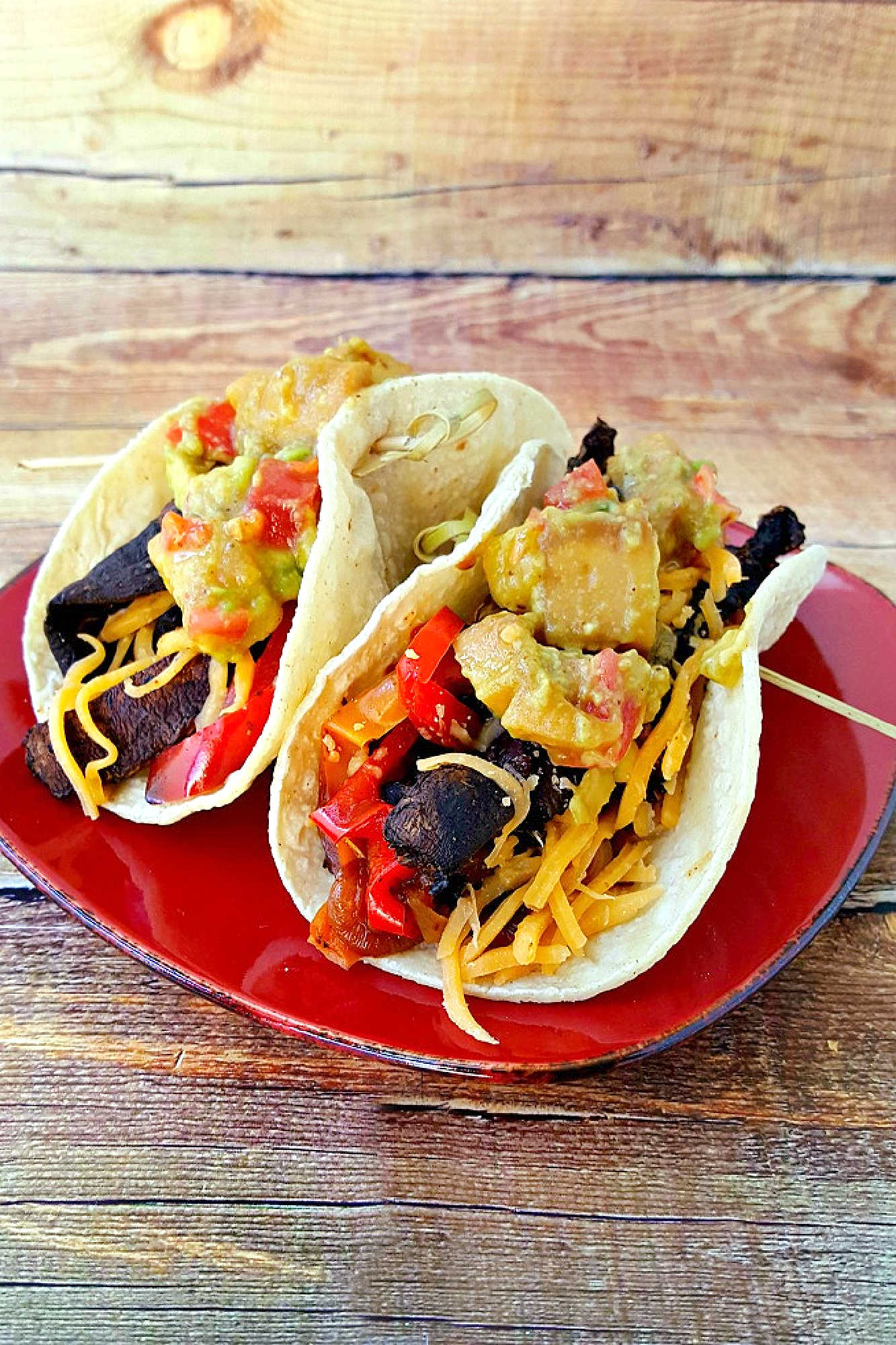 Sheet pan portobello fajitas bring bold flavors and easy clean-up to your table. Enjoy a savory mix of roasted veggies and mushrooms ready in one simple step.  #sheetpanfajitas #portobellos #plantbasedeats #easydinnerideas #weeknightmeals
