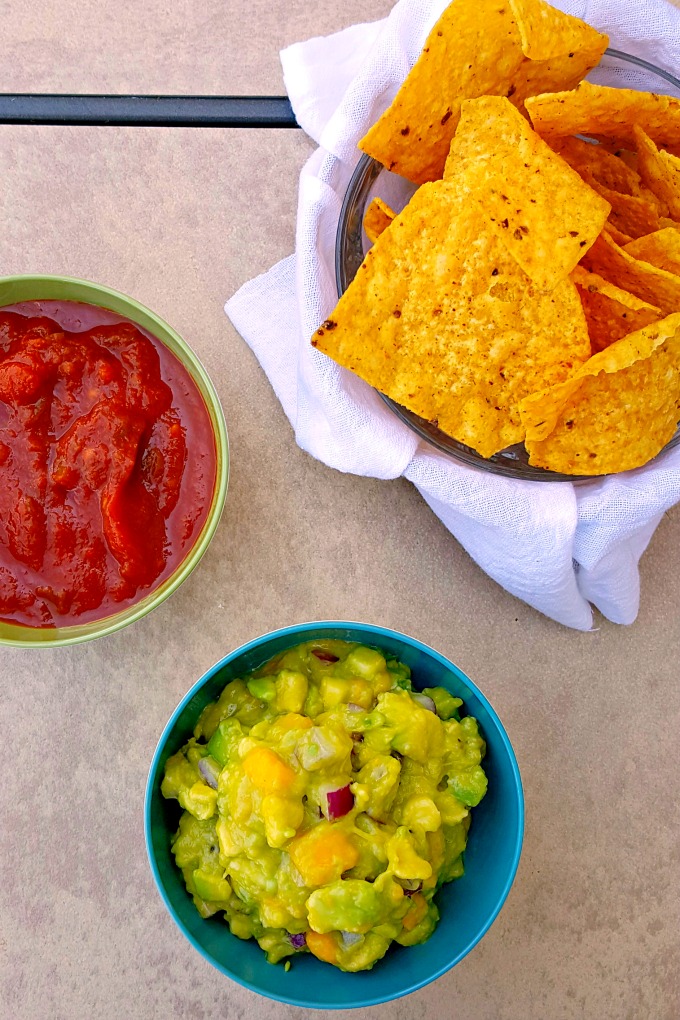 Creamy avocado, sweet mango, and spicy jalapeno make this Sweet and Spicy Mango Guacamole irresistable for #GuacSquad12.