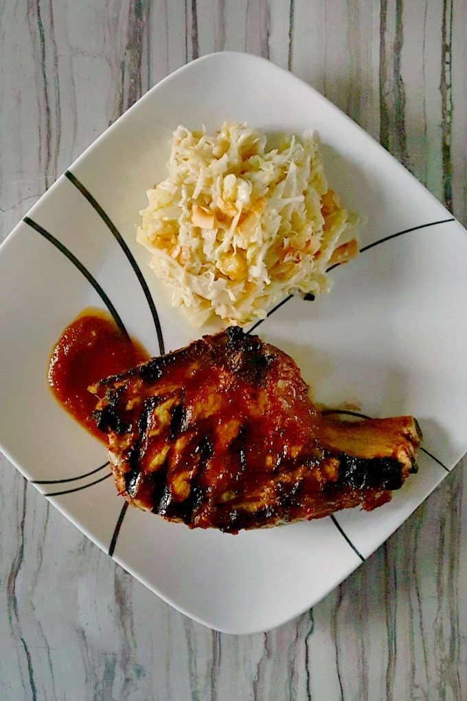 Pineapple Barbeque Chops with Colada Slaw is sweet and spicy with a delicious kick of Caribbean flavors and tropical macadamia nuts and coconut chips. It's an amazing dinner you'll love. #SundaySupper