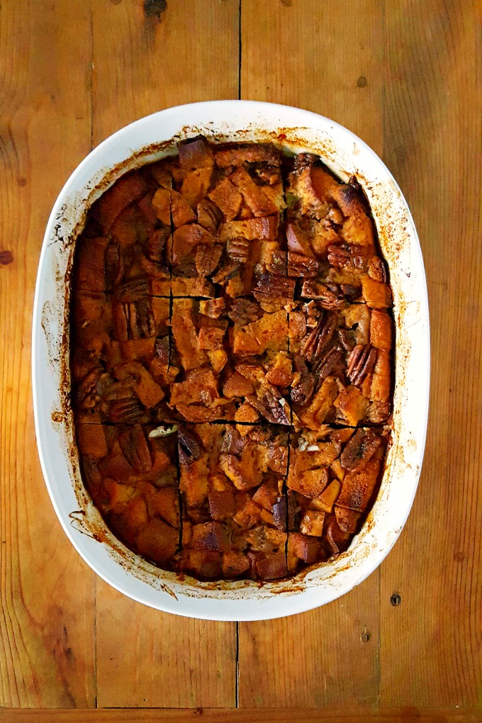 Baked donuts turned bread pudding, this Pumpkin Bread Pudding is fall in a pan with pockets of caramel bits and crunchy pecans on top! Perfect ending to #PumpkinWeek.