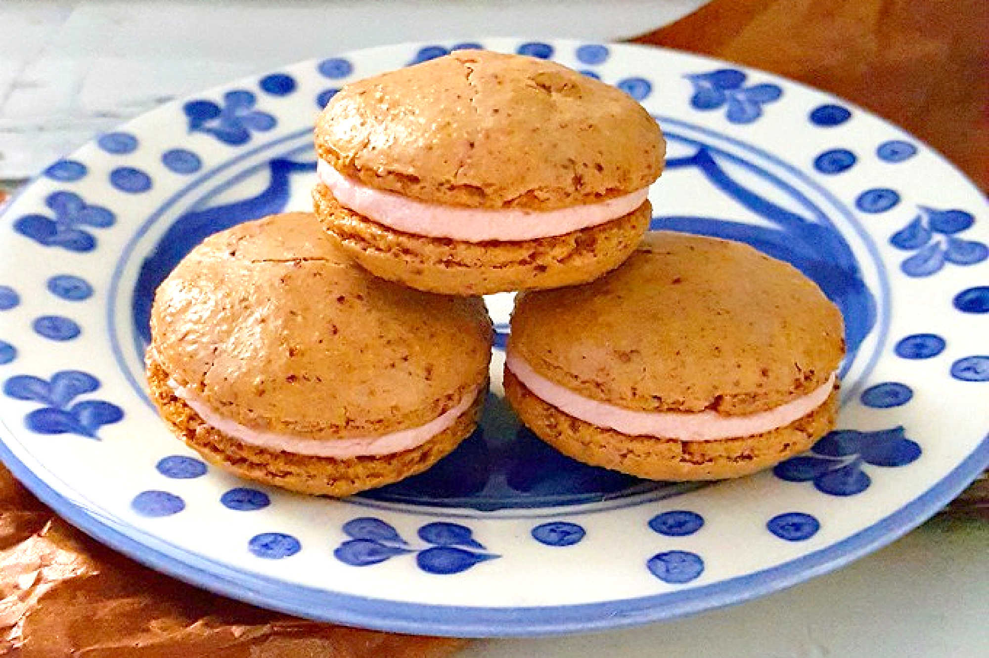 Indulge in the ultimate holiday treat with our Cranberry Walnut Macaron with Orange Buttercream! A perfect balance of sweet and tart flavors that will leave you wanting more. #HolidayTreat #CranberryWalnutMacaron #DeliciousDelights #MacaronMondays #BakedPerfection #HomemadeMacarons #CranberryWalnutDelight #CitrusButtercreamHeaven