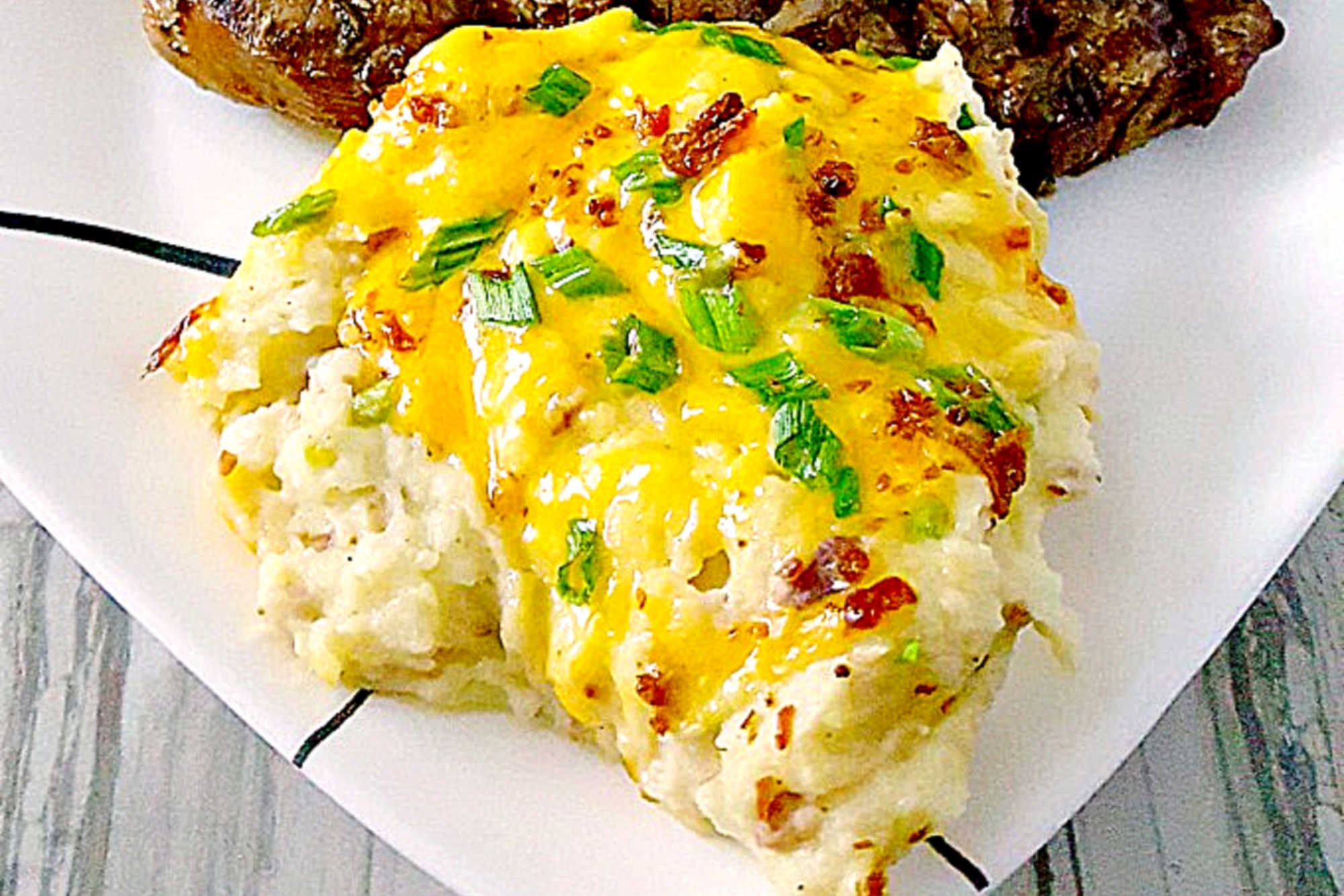 With just a few simple ingredients, you can create an amazing and delicious side dish. Twice Baked Potato Casserole has all the flavors of a twice baked potato in a flavorful side dish casserole. #potatorecipe #twicebakedpotato #potatocasserole #cheesybaconpotatoes