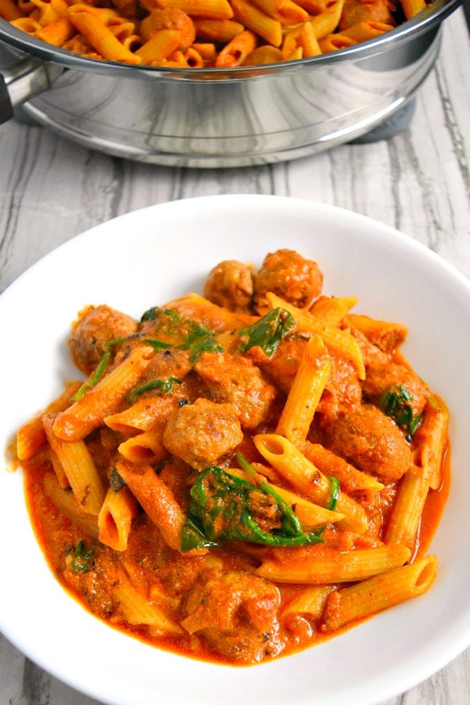 Italian sausage is simmered with a simple marinara and cream sauce. Fresh spinach is added at the end to finish off this new family favorite recipe. Your family will ask for Italian Sausage Pasta every week!!