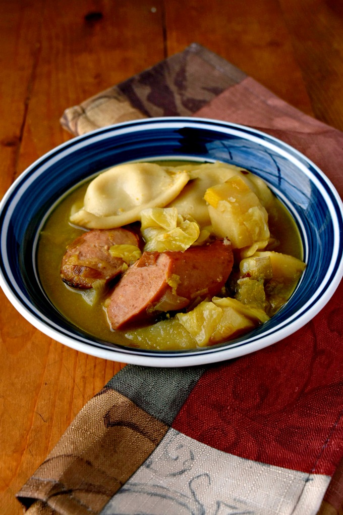 A Dublin coddle is a dish with pork sausage and rashers cooked with potatoes and onions as a stew or soup. My Polish Coddle uses kielbasa, potatoes, and onions topped it with mini pierogies.