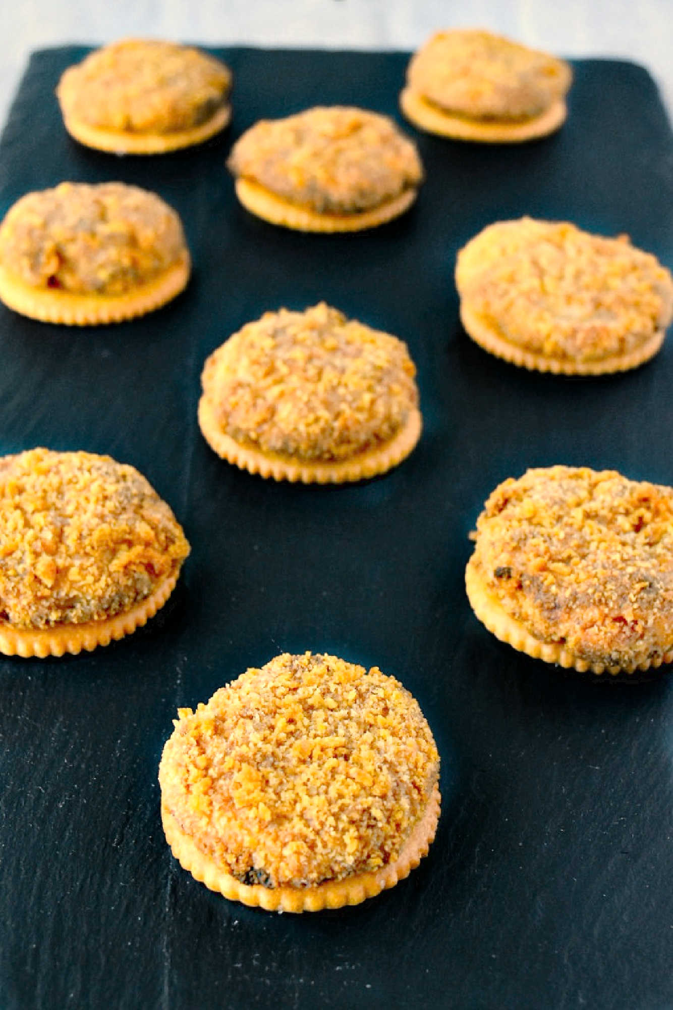 Looking for a unique twist on the classic crab cake? These Crab Cake Bites are packed with flavor and the perfect size for tapas. #OurFamilyTable #summer #seafoodlovers #appetizers #partyfood #CrabCakeBites #SeafoodAppetizer #FoodieFaves #DeliciouslyDiverse #FingerFoodFriday #ComfortFood #SeafoodLoversUnite #SmallBitesBigFlavors #CrabCakeCraze #FoodieFaves #EasyEntertainingEats