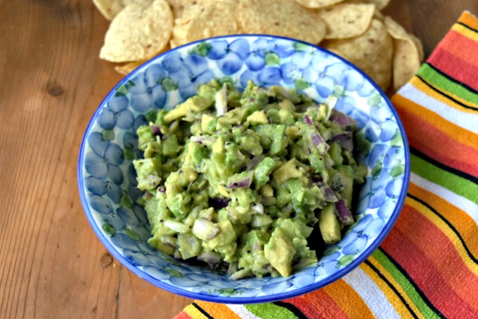 The sweet kiwi and the creamy avocado pair well with the jalapeno in this delicious guacamole. Kiwi Guacamole is addictively delicious and perfect for summer nibbles.