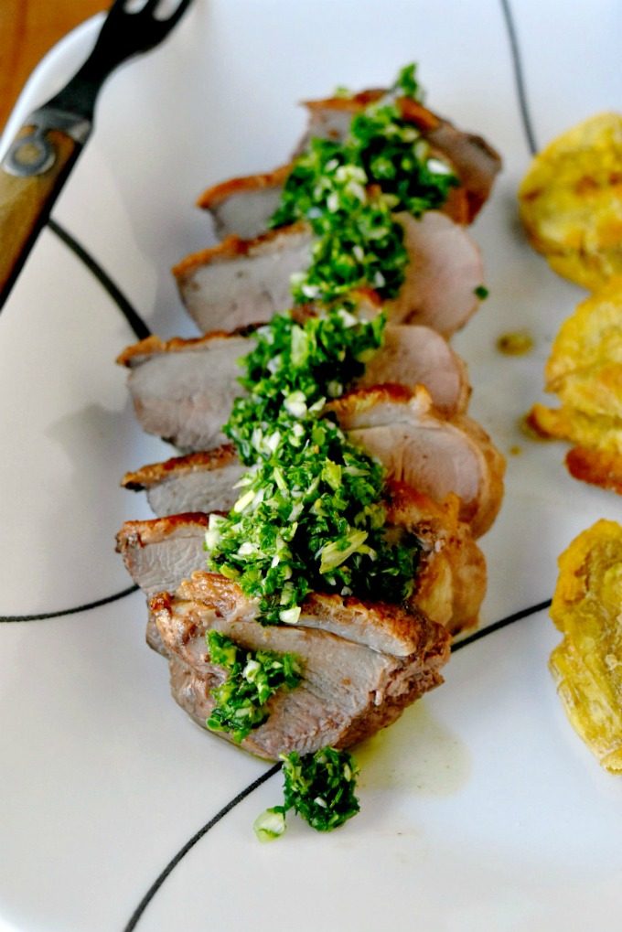 Chimichurri Crispy Duck with Baked Tostones is not your typical duck breast recipe! The skin is crispy, the chimichurri is delicious and the baked tostones round out the Latin American meal. Chimichurri Crispy Duck with Baked Tostones