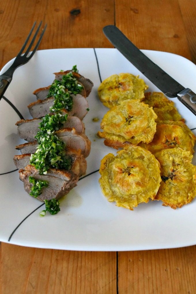 Chimichurri Crispy Duck with Baked Tostones is not your typical duck breast recipe! The skin is crispy, the chimichurri is delicious and the baked tostones round out the Latin American meal. Chimichurri Crispy Duck with Baked Tostones
