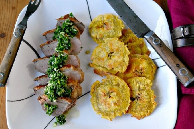 Chimichurri Crispy Duck with Baked Tostones is not your typical duck breast recipe! The skin is crispy, the chimichurri is delicious and the baked tostones round out the Latin American meal. Chimichurri Crispy Duck with Baked Tostones
