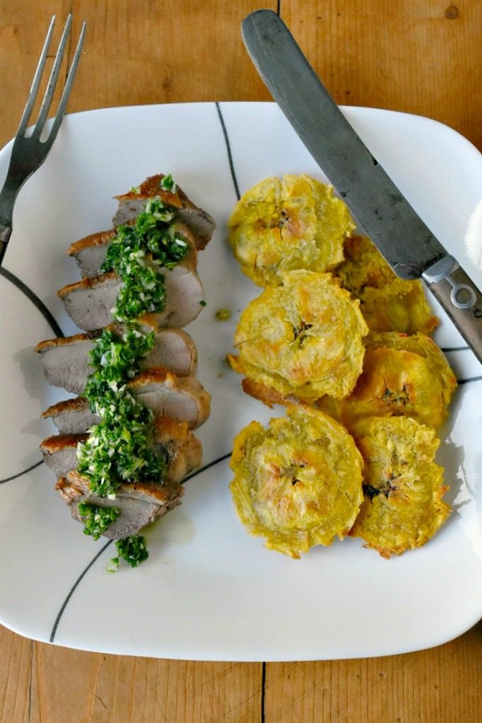 Chimichurri Crispy Duck with Baked Tostones is not your typical duck breast recipe! The skin is crispy, the chimichurri is delicious and the baked tostones round out the Latin American meal. Chimichurri Crispy Duck with Baked Tostones