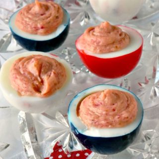 I kicked up my usual deviled egg recipe with delicious beets. These Red White & Blue Deviled Eggs are tasty and fun for your Fourth of July! #SundaySupper