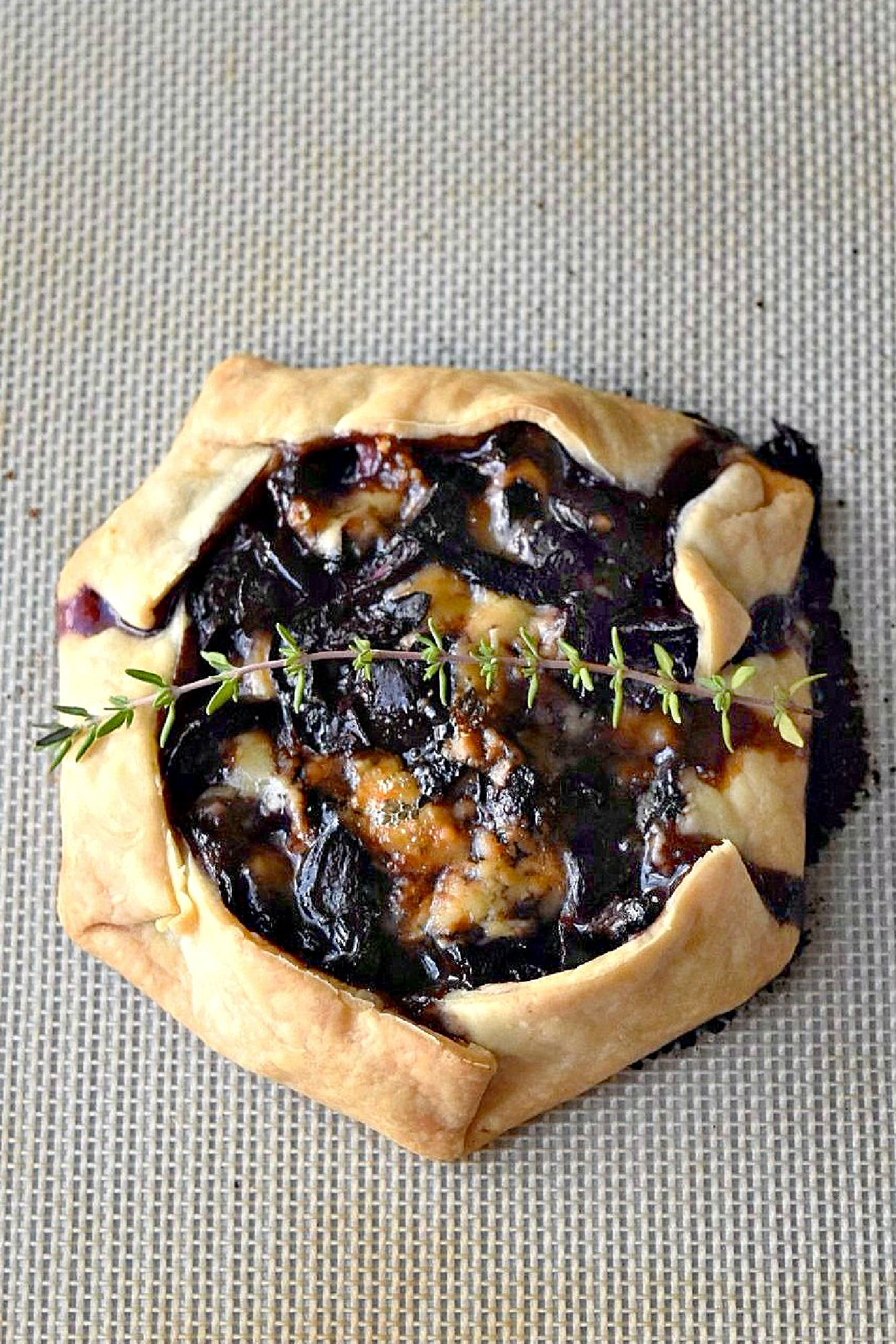 Cherry Stilton Crostata takes on an innovative twist to a classic Italian recipe by combining juicy cherries with creamy Stilton cheese, all wrapped up in a golden-brown flaky pastry. #CrostataCreations #SweetTreats #PastryPerfection #CherryStiltonCombo #BakeFromScratch #SavoryDesserts #FoodieFinds #BakingInspiration #CheeseLoversUnite #stonefruit #cherryrecipe #cherries #crostata #appetizer #fruitandcheese
