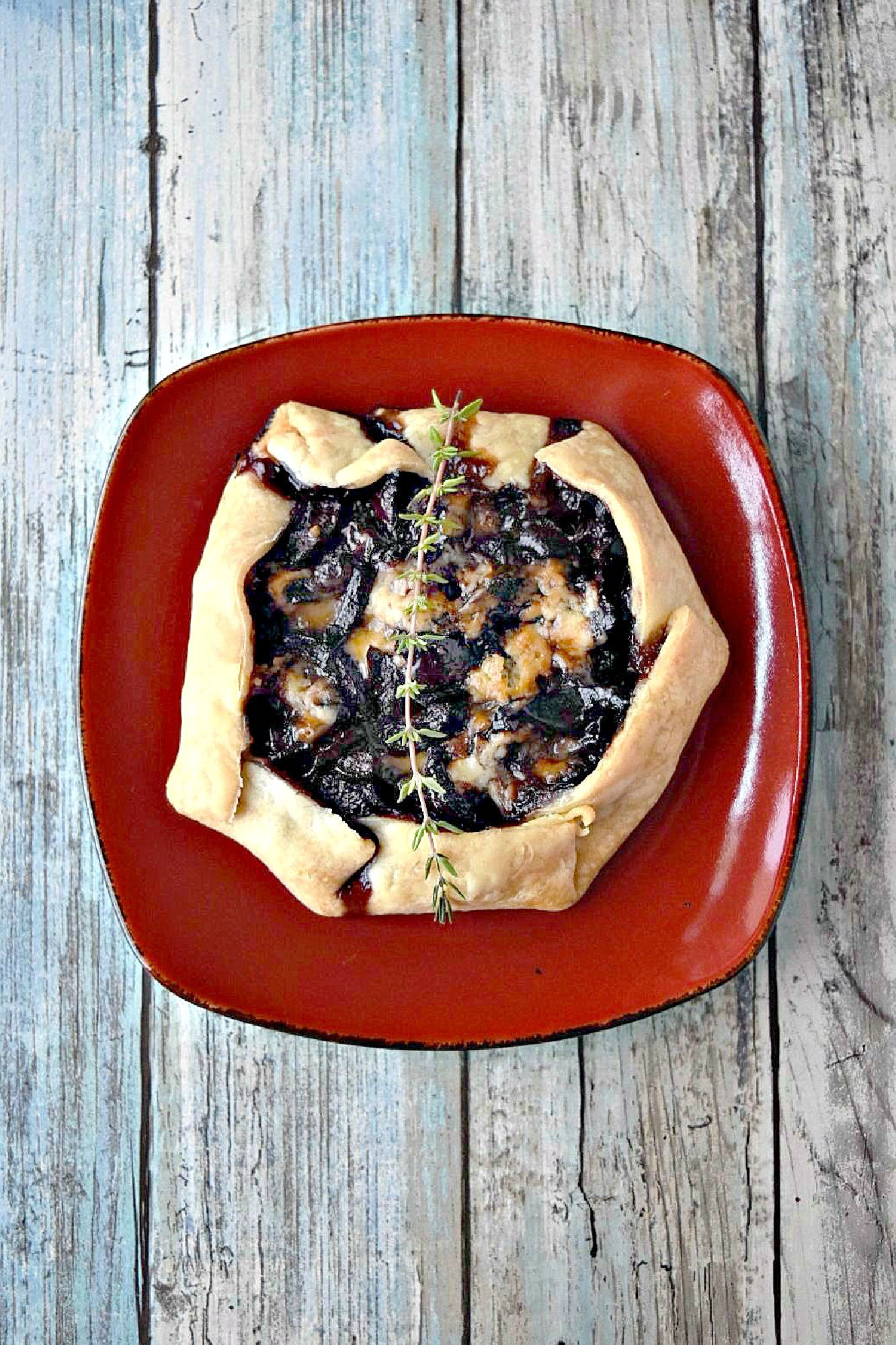 Cherry Stilton Crostata takes on an innovative twist to a classic Italian recipe by combining juicy cherries with creamy Stilton cheese, all wrapped up in a golden-brown flaky pastry. #CrostataCreations #SweetTreats #PastryPerfection #CherryStiltonCombo #BakeFromScratch #SavoryDesserts #FoodieFinds #BakingInspiration #CheeseLoversUnite #stonefruit #cherryrecipe #cherries #crostata #appetizer #fruitandcheese
