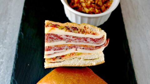 This is a muffaletta you could easy make for a crowd or a picnic. Overnight Muffaletta Sandwich is quick to make but tastes oh so delicious! Laissez les bons temps rouler!!