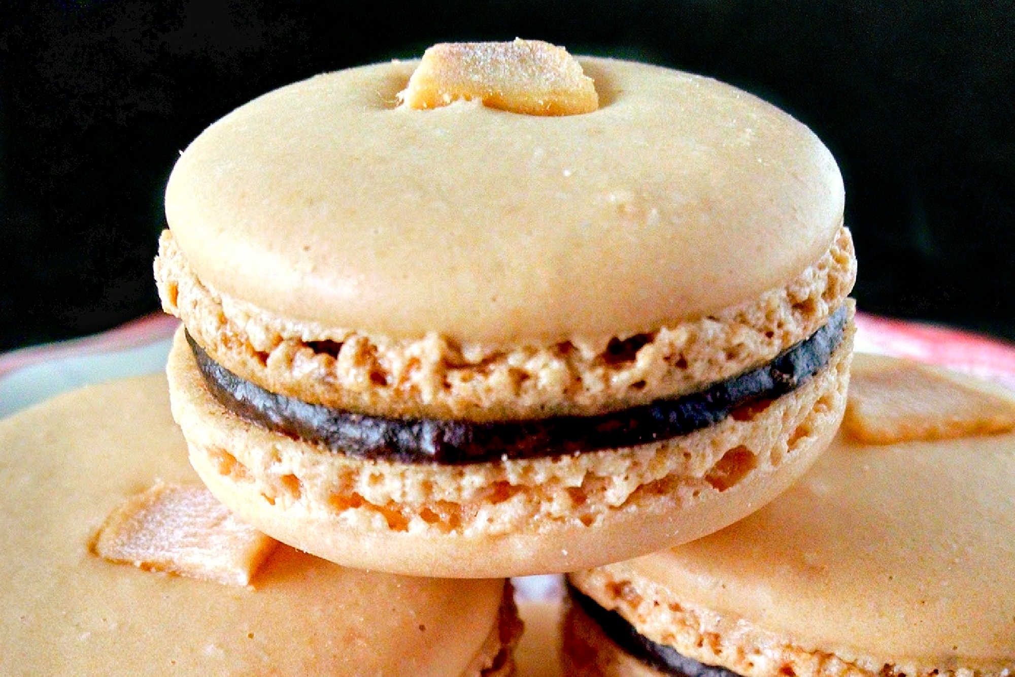 Satisfy your sweet tooth with a twist! Try these German Chocolate Cake Macarons for a unique and indulgent dessert experience. Made with coconut chips they have the sweet coconut flavor and chocolate deliciousness of the iconic cake. #GermanChocolateCakeMacaron #MacaronObsession #SatisfyYourSweetTooth #FoodieFridays #DessertHeaven