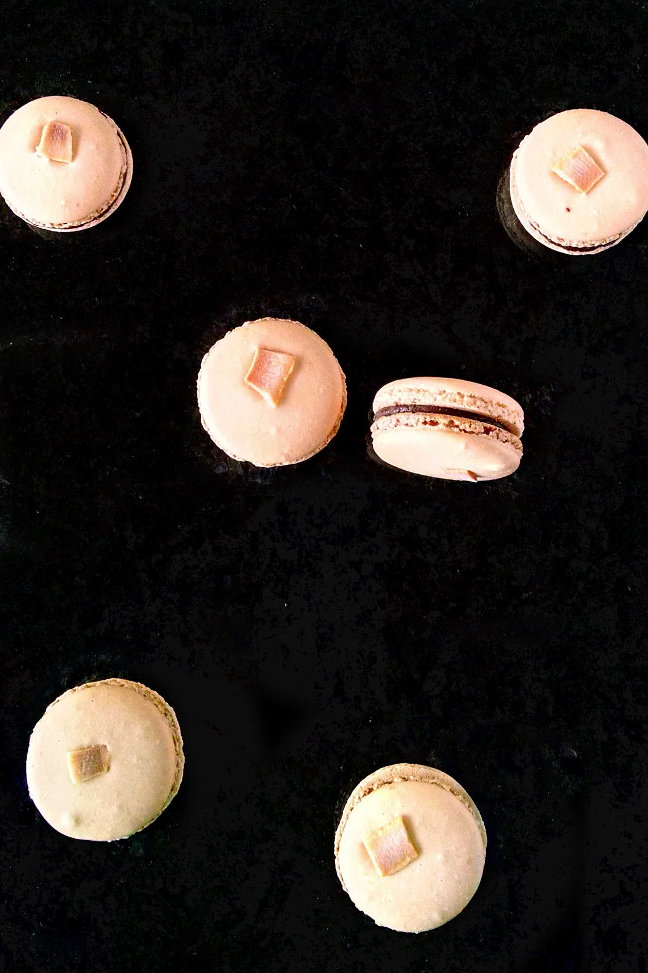Satisfy your sweet tooth with a twist! Try these German Chocolate Cake Macarons for a unique and indulgent dessert experience. Made with coconut chips they have the sweet coconut flavor and chocolate deliciousness of the iconic cake. #GermanChocolateCakeMacaron #MacaronObsession #SatisfyYourSweetTooth #FoodieFridays #DessertHeaven