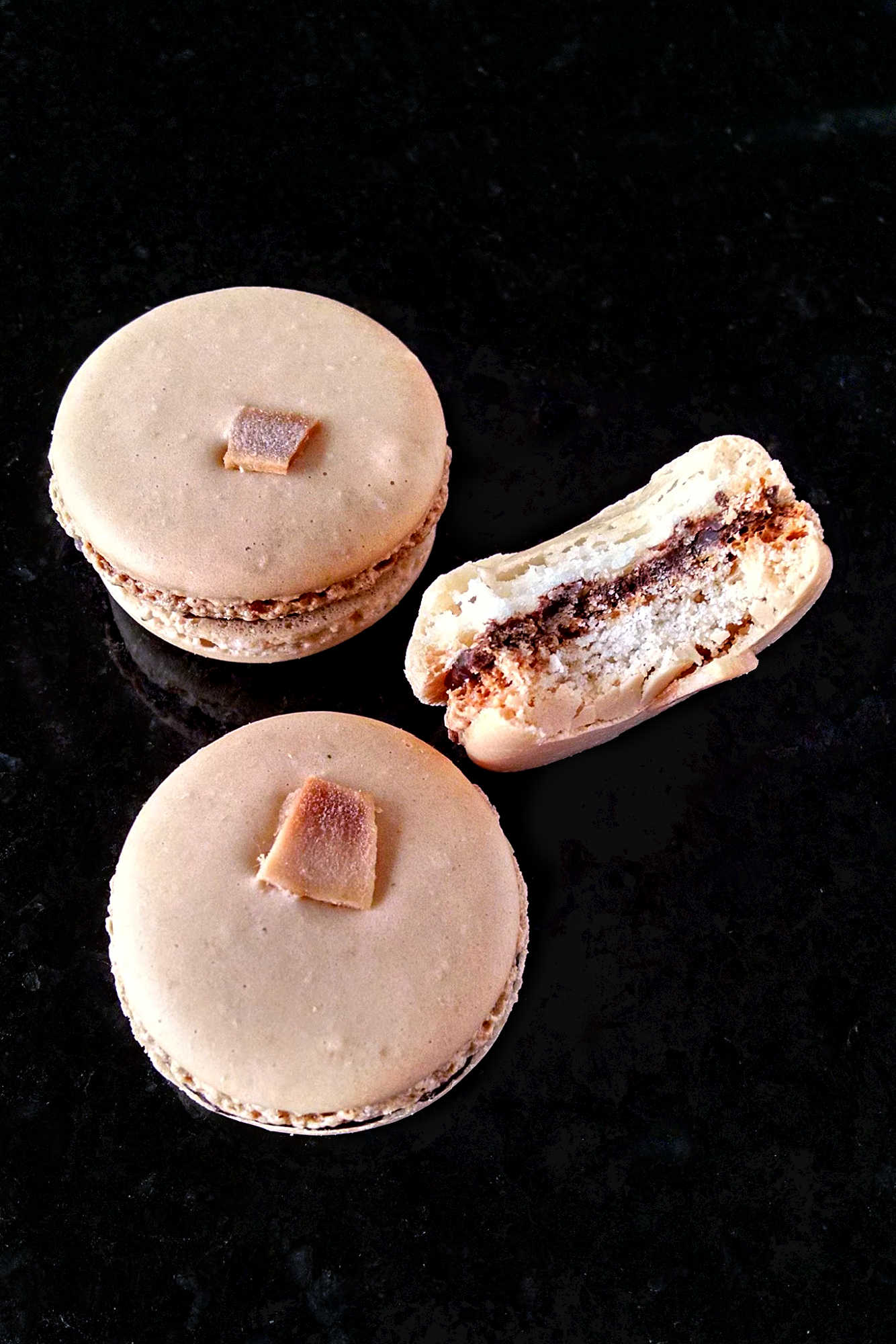 Satisfy your sweet tooth with a twist! Try these German Chocolate Cake Macarons for a unique and indulgent dessert experience. Made with coconut chips they have the sweet coconut flavor and chocolate deliciousness of the iconic cake. #GermanChocolateCakeMacaron #MacaronObsession #SatisfyYourSweetTooth #FoodieFridays #DessertHeaven