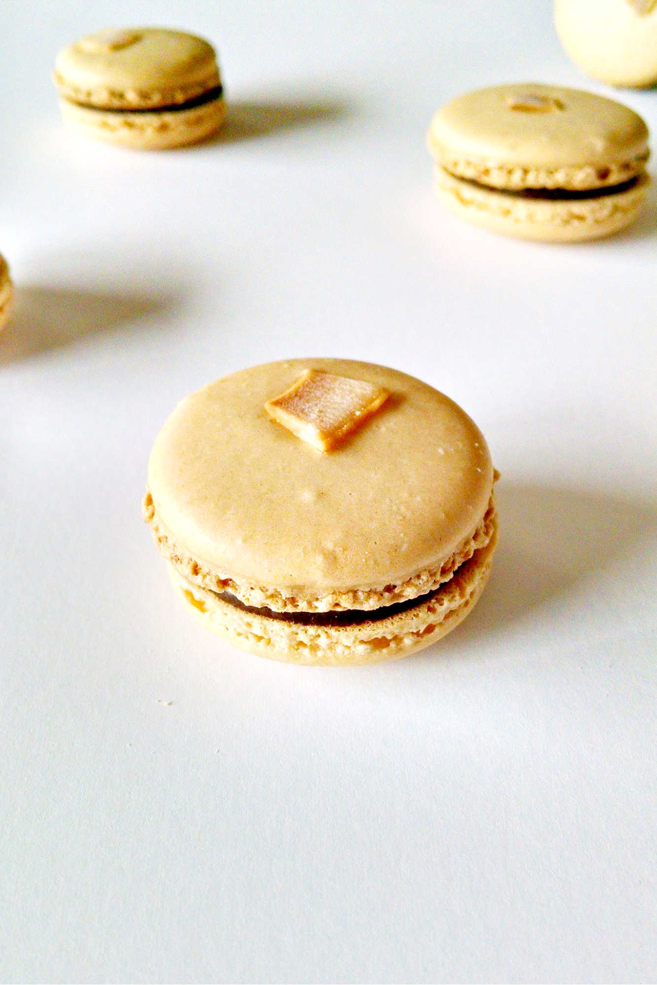 Satisfy your sweet tooth with a twist! Try these German Chocolate Cake Macarons for a unique and indulgent dessert experience. Made with coconut chips they have the sweet coconut flavor and chocolate deliciousness of the iconic cake. #GermanChocolateCakeMacaron #MacaronObsession #SatisfyYourSweetTooth #FoodieFridays #DessertHeaven