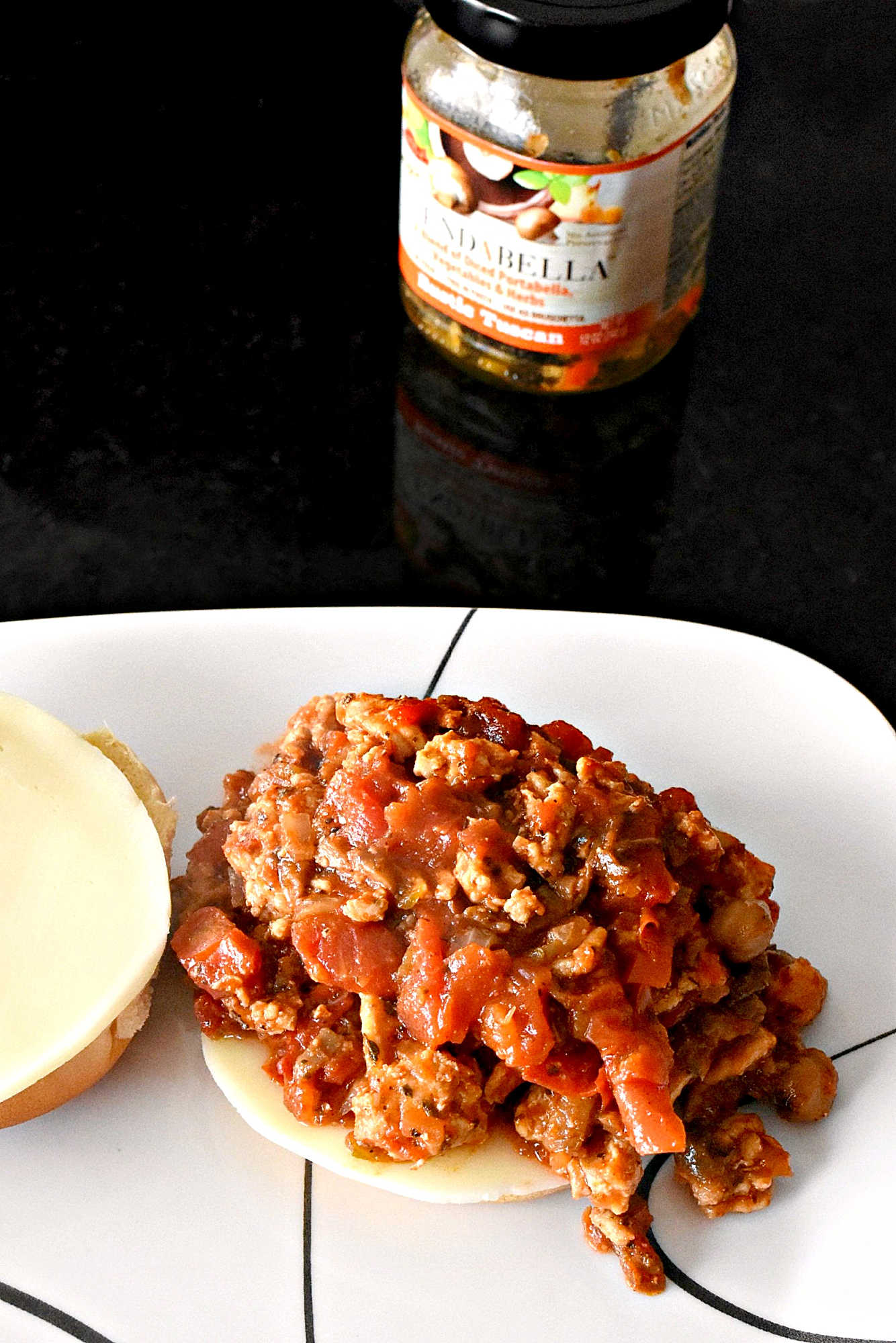 Mix up your traditional Sloppy Joe recipe with a Tuscan twist! These Tuscan Chicken Sloppy Joes are sure to be a hit with the whole family.  #TuscanChickenSloppyJoes #ComfortFoodCravings #ItalianInspiredEats #WeeknightDinnerIdeas #SloppyJoeVariations  #ItalianFlavors #HomemadeDinnerIdeas #EasyWeeknightMeals #FoodieFav